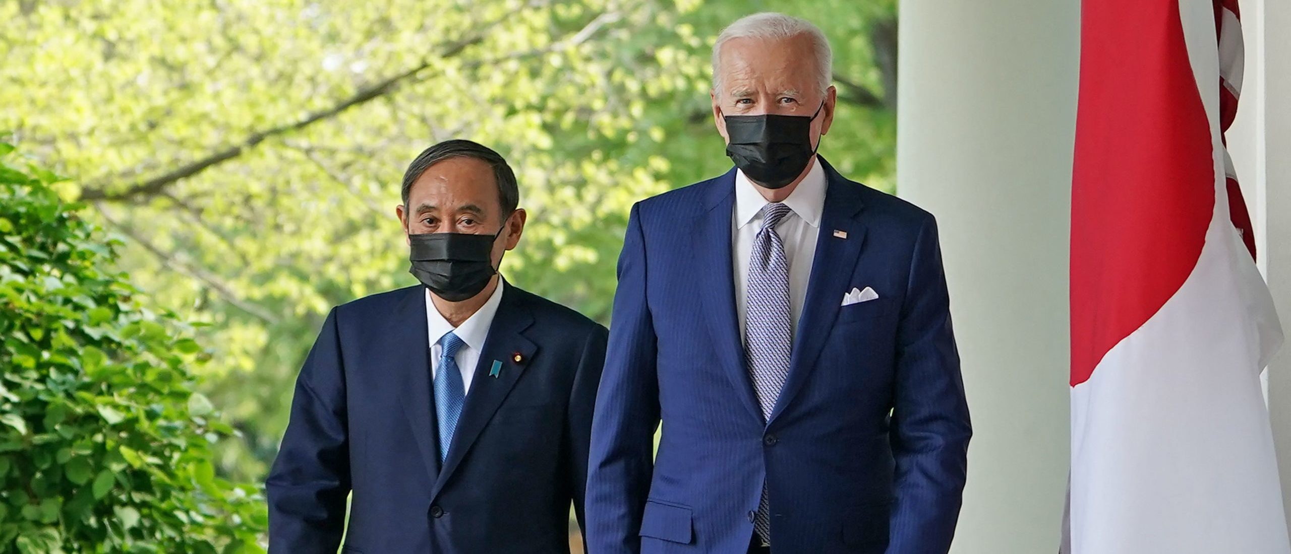 US President Joe Biden and Japan's Prime Minister Yoshihide Suga walk through the Colonnade to take part in a joint press conference in the Rose Garden of the White House in Washington, DC on April 16, 2021. (Photo by MANDEL NGAN/AFP via Getty Images)