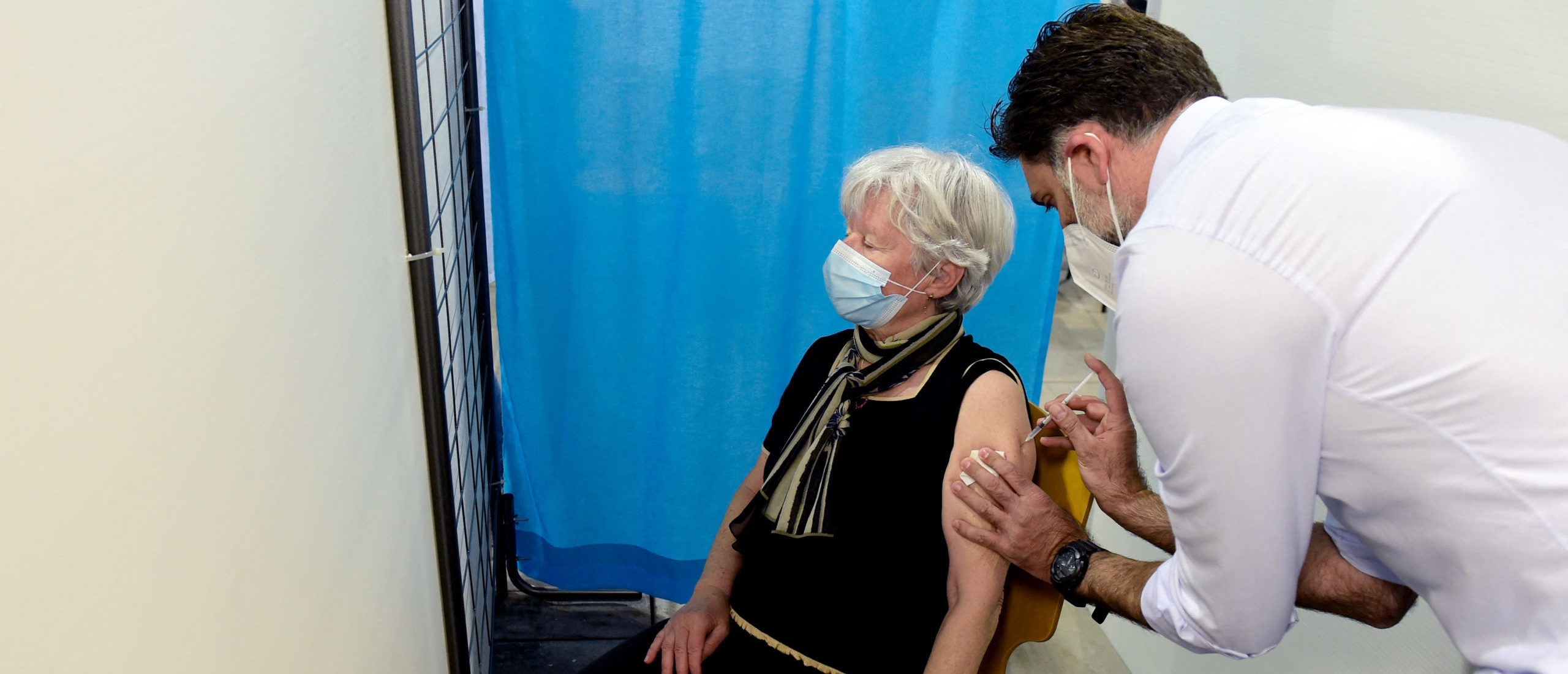 A nurse administers a dose of the Pfizer/BioNTech Covid-19 vaccine to a member of the public at a vaccination centre set up in the Parc Chanot exhibition centre in Marseille, southeastern France, on April 19, 2021. (Photo by NICOLAS TUCAT/AFP via Getty Images)