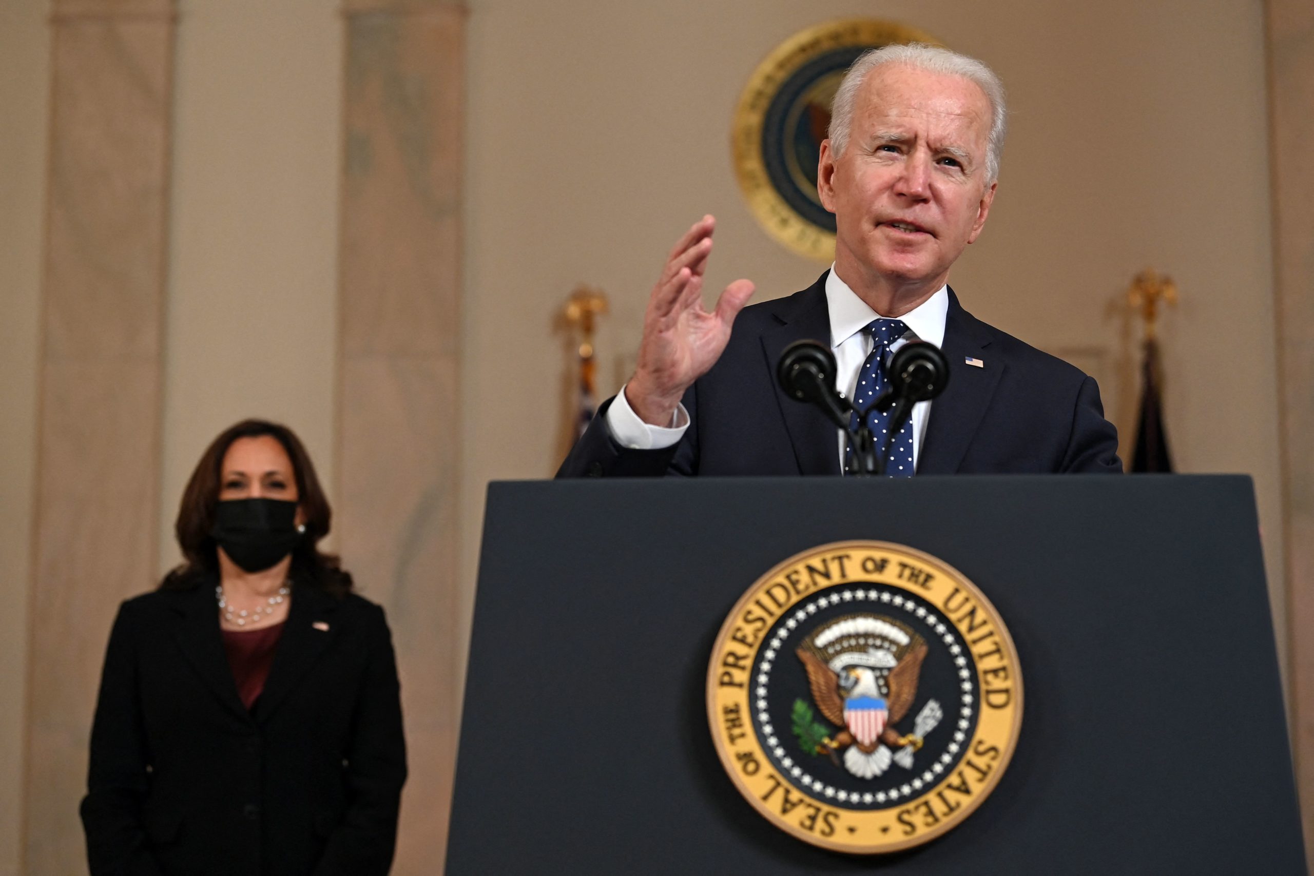 Vice President Kamala Harris (L) listens as US President Joe Biden delivers remarks on the guilty verdict against former policeman Derek Chauvin at the White House in Washington, DC, on April 20, 2021. - Derek Chauvin, a white former Minneapolis police officer, was convicted on April 20 of murdering African-American George Floyd after a racially charged trial that was seen as a pivotal test of police accountability in the United States. (Photo by BRENDAN SMIALOWSKI/AFP via Getty Images)