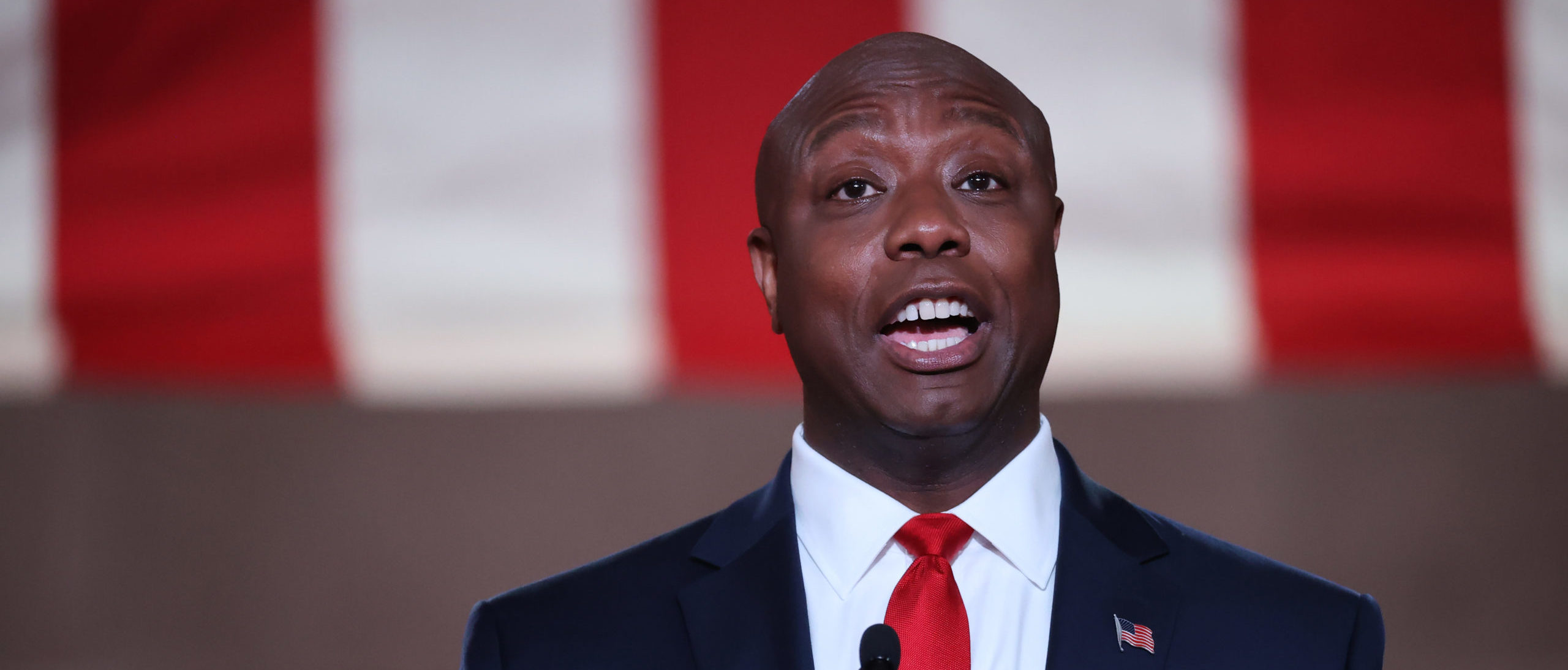 WASHINGTON, DC - AUGUST 24: U.S. Sen. Tim Scott (R-SC) stands on stage in an empty Mellon Auditorium while addressing the Republican National Convention at the Mellon Auditorium on August 24, 2020 in Washington, DC. The novel coronavirus pandemic has forced the Republican Party to move away from an in-person convention to a televised format, similar to the Democratic Party's convention a week earlier. (Photo by Chip Somodevilla/Getty Images)