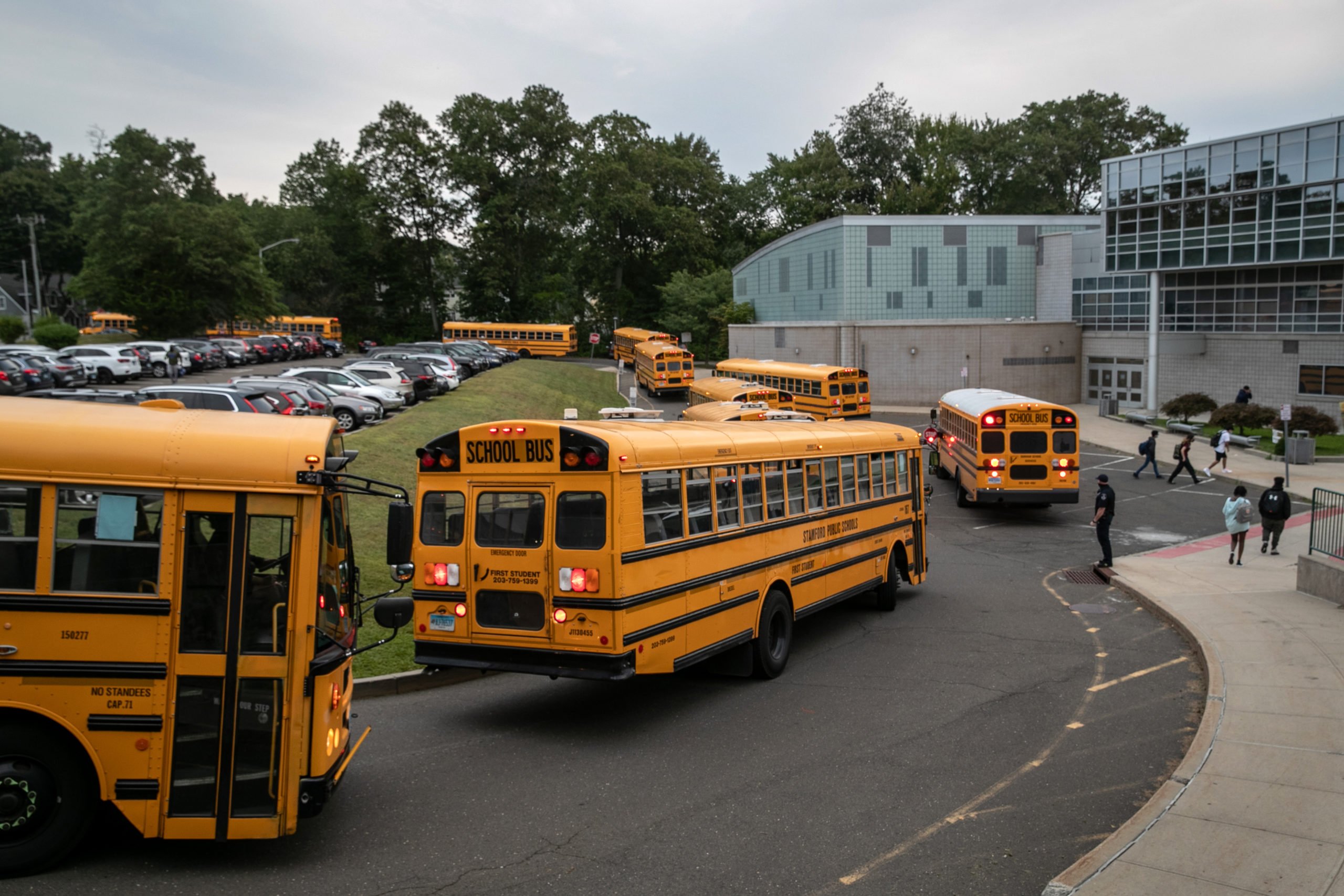 Busses drop-off students at Rippowam Middle School on September 14, 2020 in Stamford, Connecticut. (John Moore/Getty Images)