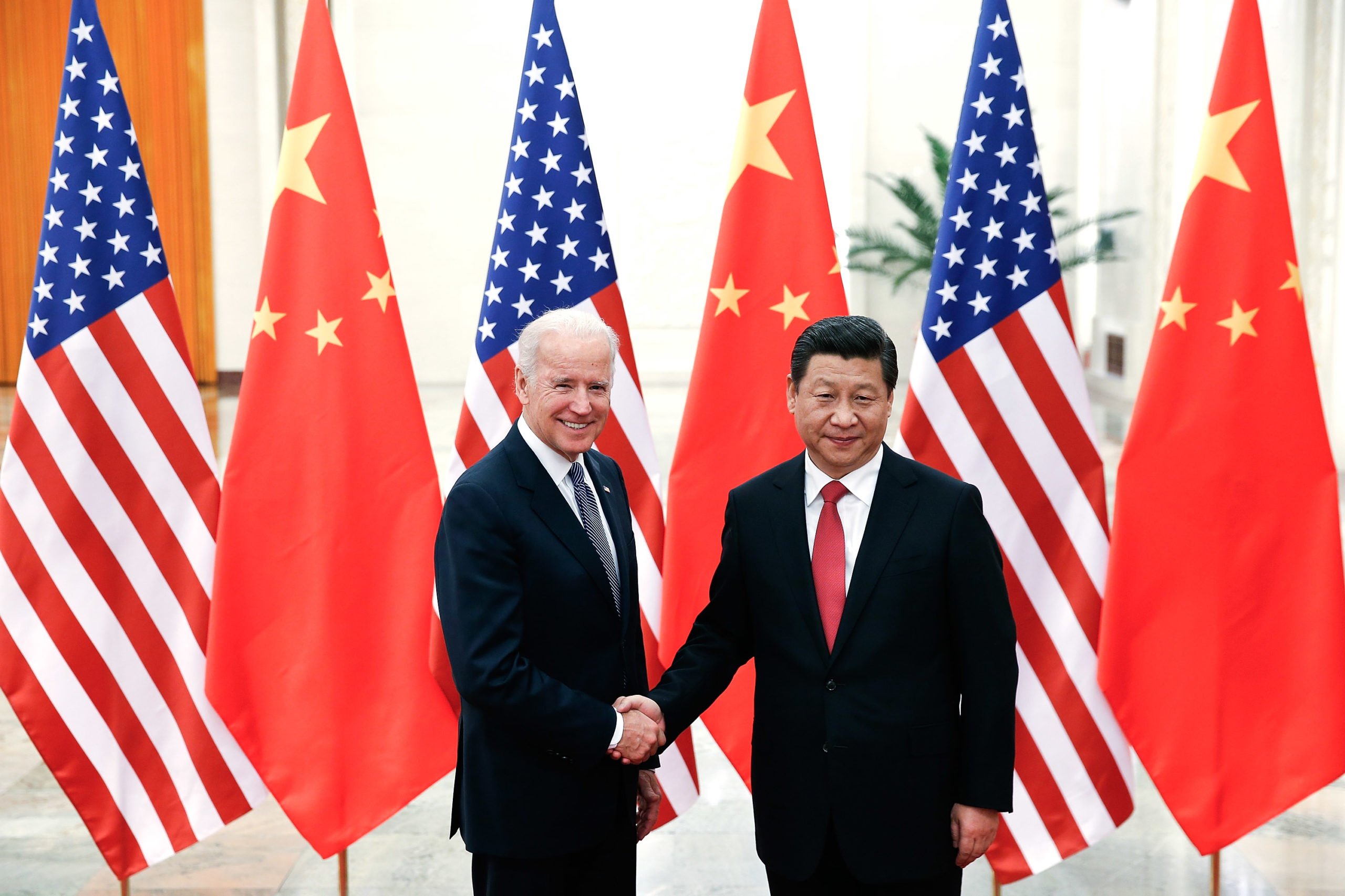 BEIJING, CHINA - DECEMBER 04: Chinese President Xi Jinping (R) shake hands with U.S Vice President Joe Biden (L) inside the Great Hall of the People on December 4, 2013 in Beijing, China. U.S Vice President Joe Biden will pay an official visit to China from December 4 to 5. (Photo by Lintao Zhang/Getty Images)