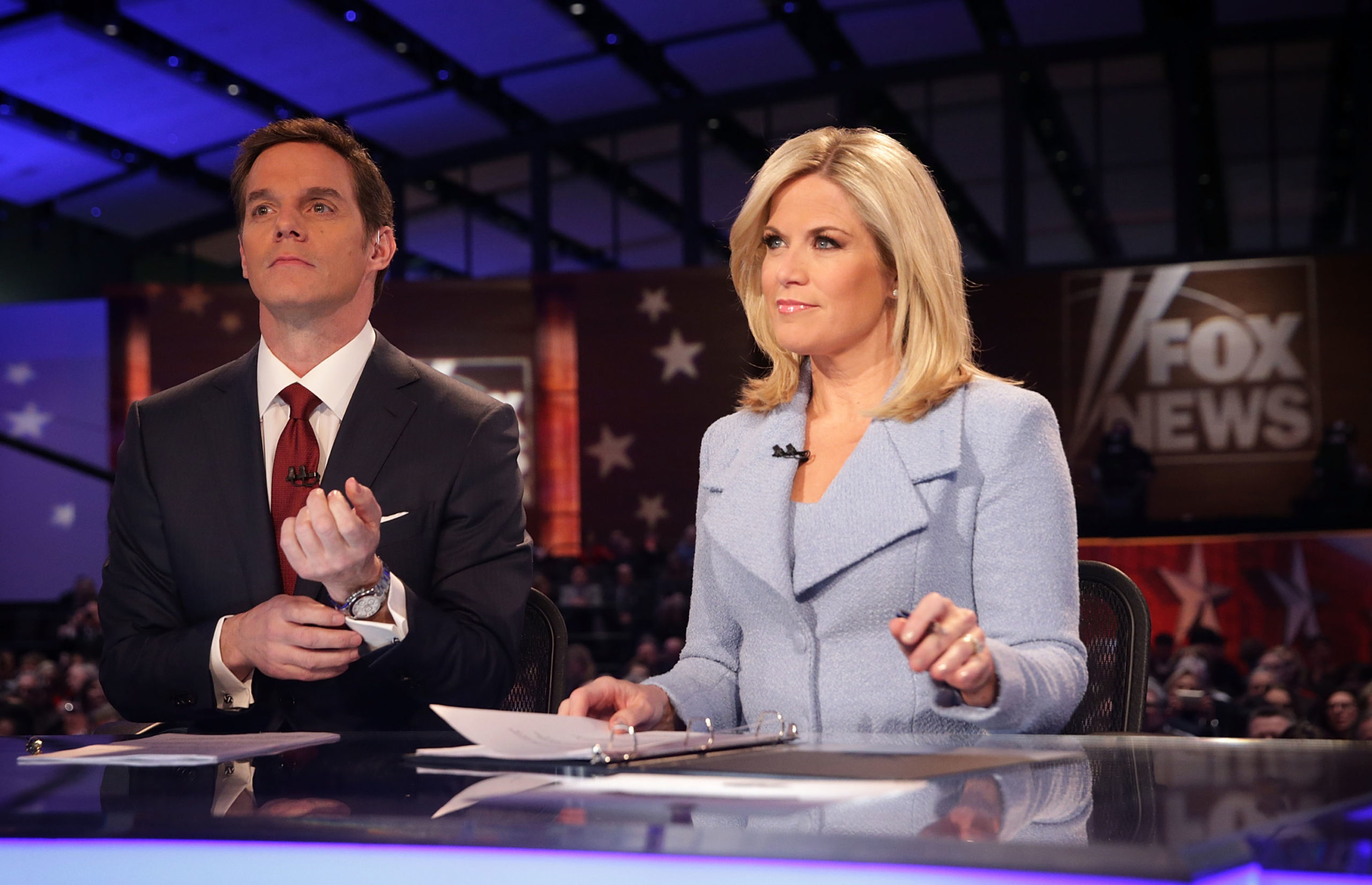 Moderators Martha MacCallum (R) and Bill Hemmer (L) wait for the beginning of the first forum of the Fox News - Google GOP Debate January 28, 2016 at the Iowa Events Center in Des Moines, Iowa. (Alex Wong/Getty Images)