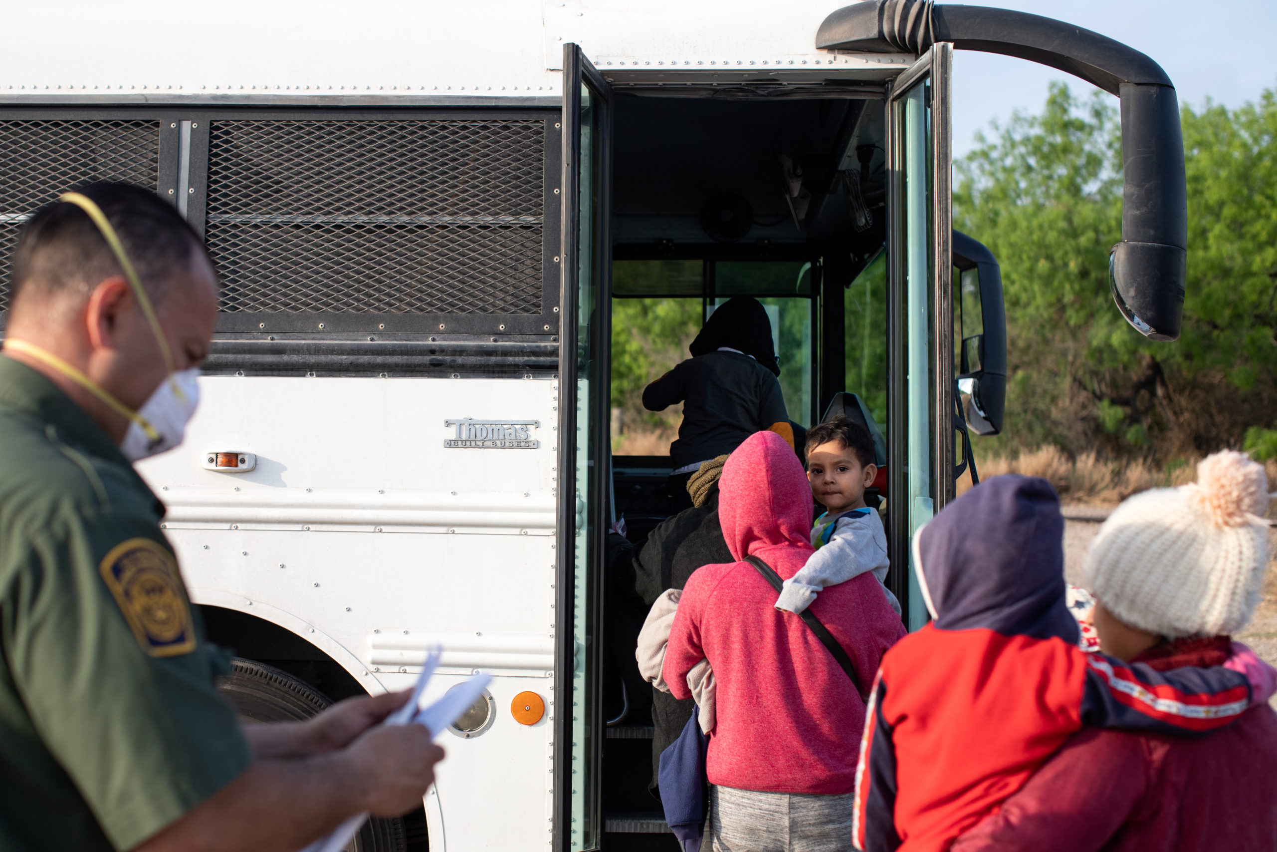 Illegal migrants wait to be transported to Customs and Border Protection facilities after waiting overnight next to a road in La Joya, Texas on March 27, 2021. (Kaylee Greenlee - Daily Caller News Foundation)