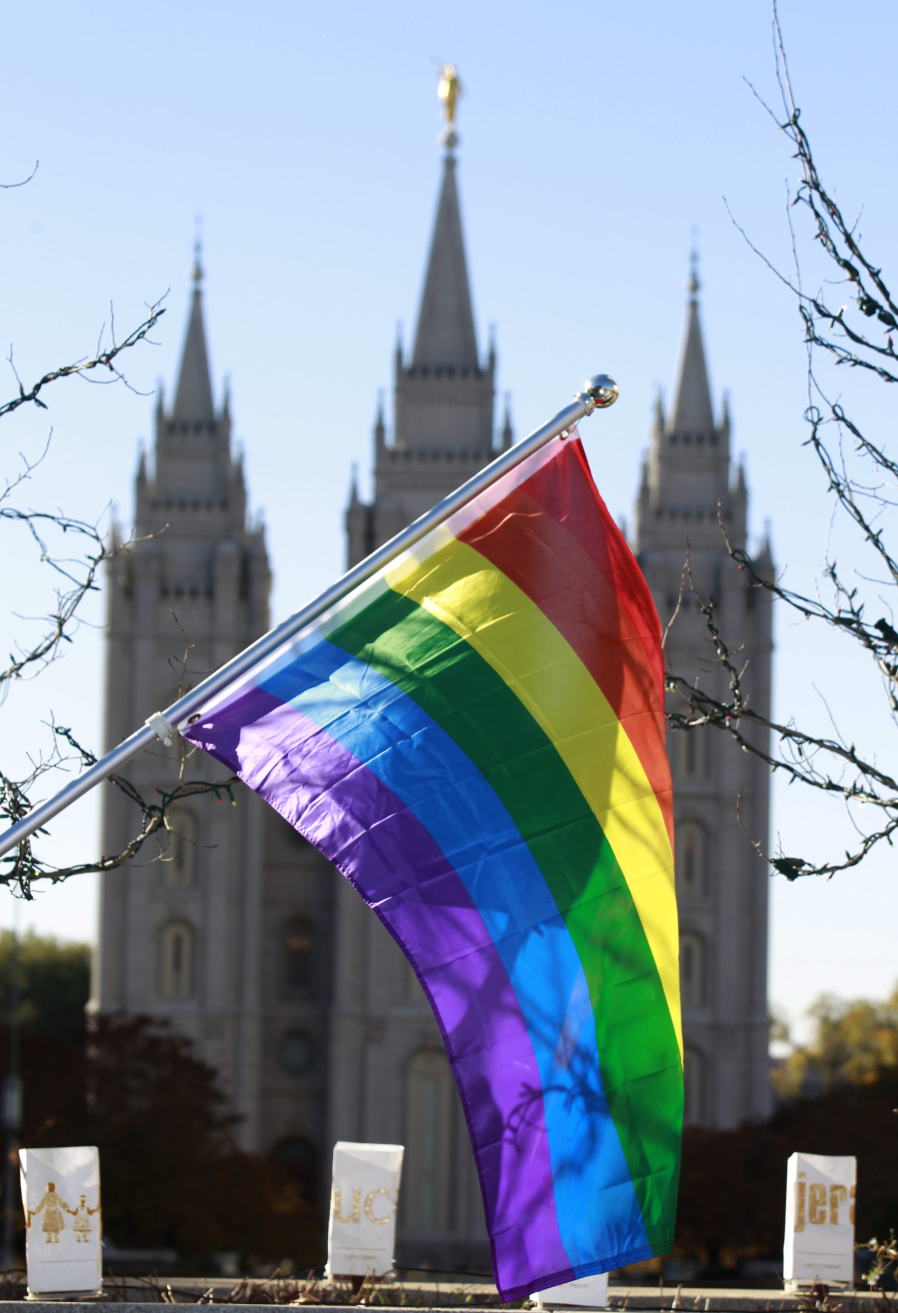 SALT LAKE CITY, UT - NOVEMBER14: A pride flag flies in front of the Historic Mormon Temple as part of a protest where people resigned from the Church of Jesus Christ of Latter-Day Saints in response to a recent change in church policy towards married LGBT same sex couples and their children on November 14, 2015 in Salt Lake City, Utah. A little over a week ago the Mormon church made a change in their official handbook of instructions requiring a disciplinary council and possible excommunication for same sex couples and banning the blessing and baptism of their children into the church. (Photo by George Frey/Getty Images)