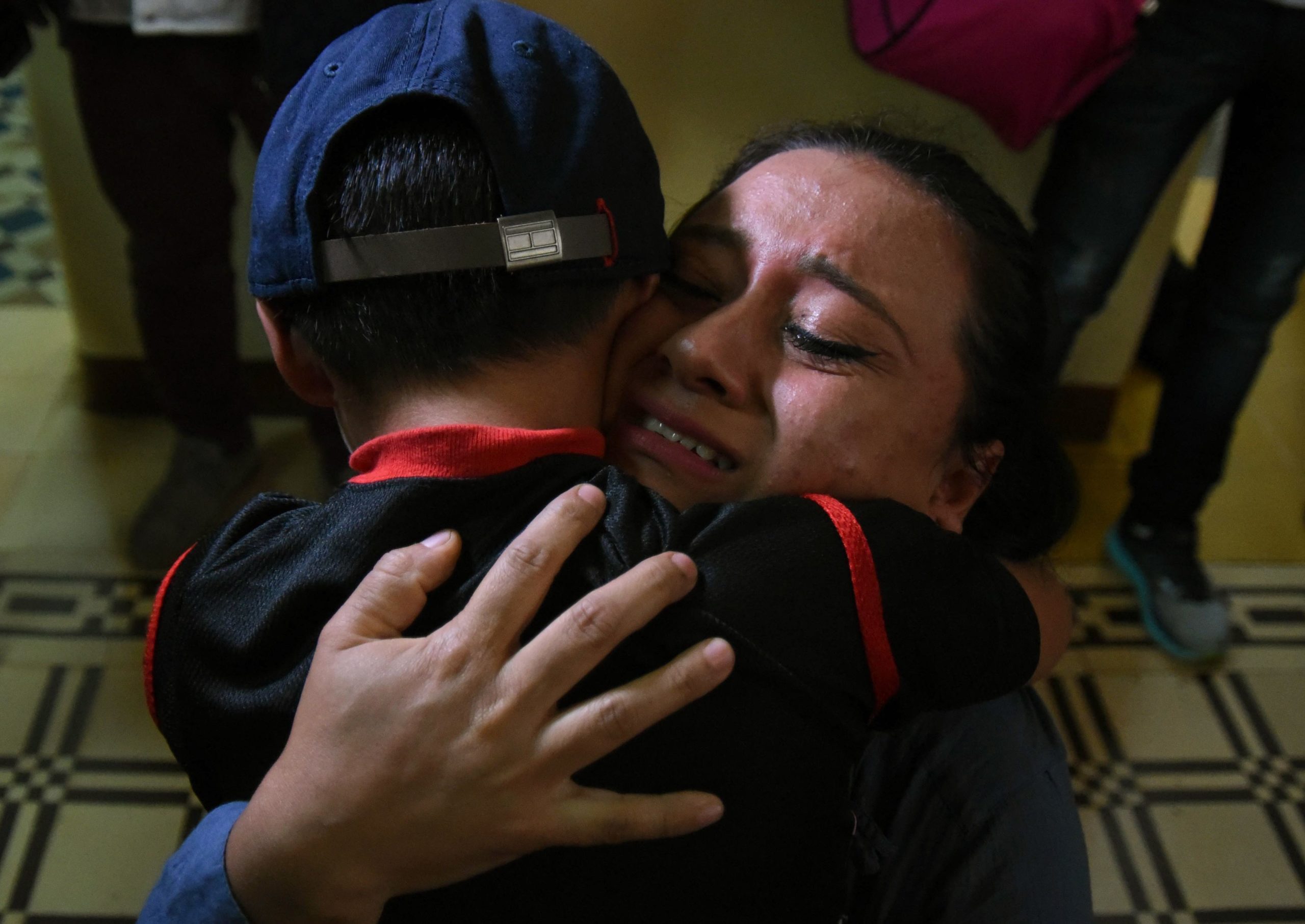 Lourdes de Leon hugs her son Leo -one of three minors who had been separated from their family on the U.S. border- upon arrival at the shelter "Nuestras Raíces" in Guatemala City, on August 7, 2018. (Photo credit should read ORLANDO ESTRADA/AFP via Getty Images)