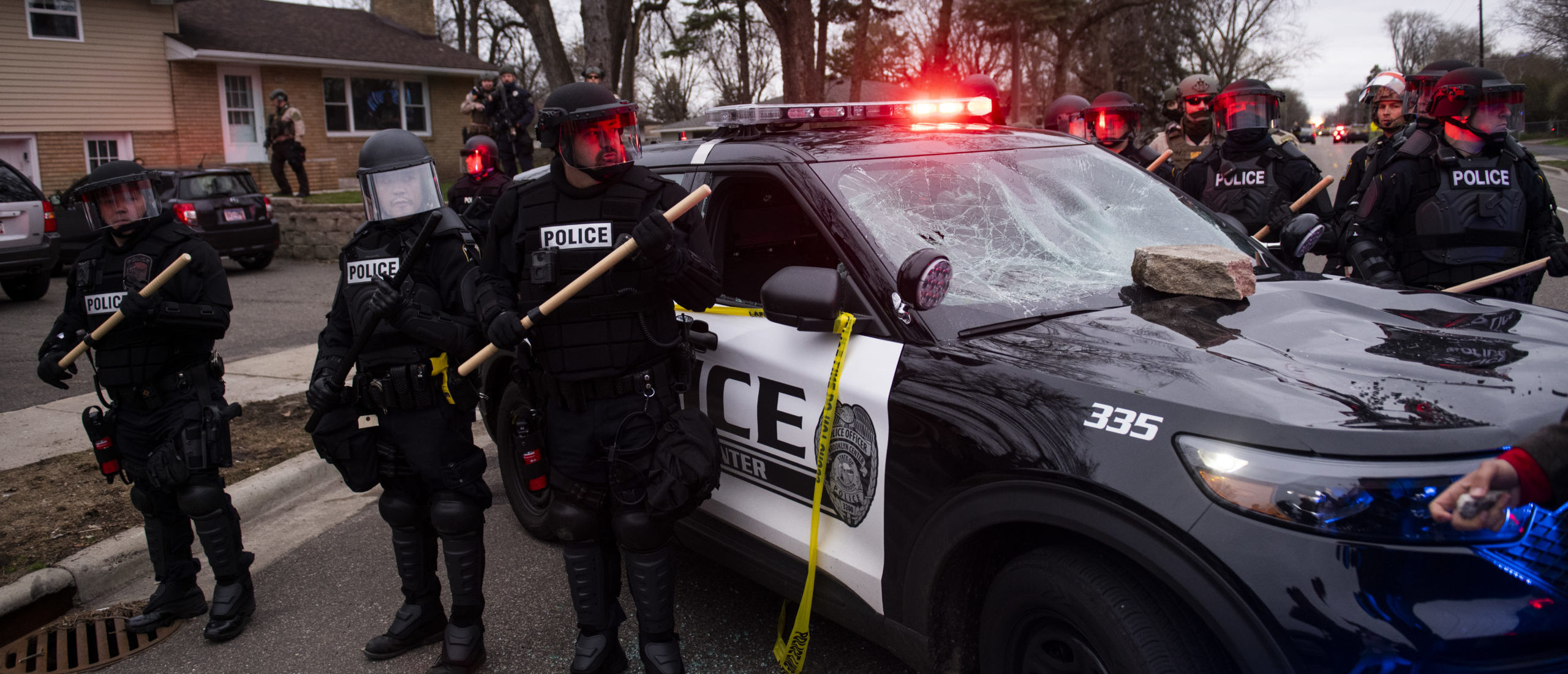 BROOKLYN CENTER, MN - APRIL 11: Law enforcement surrounds a smashed police cruiser on April 11, 2021 in Brooklyn Center, Minnesota. A crowd gathered after Brooklyn Center police shot and killed Daunte Wright during a traffic stop to earlier today. (Photo by Stephen Maturen/Getty Images)