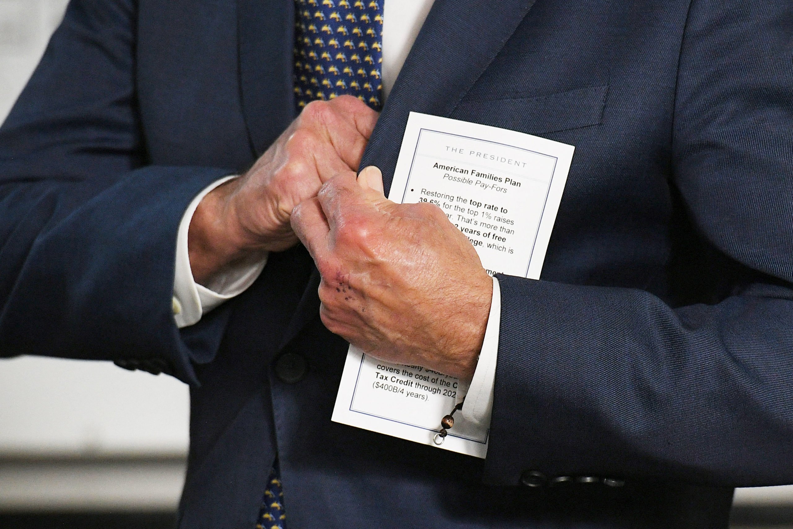 President Joe Biden holds a note card while being introduced before speaking on the American Jobs Plan on May 3. (Mandel Ngan/AFP via Getty Images)