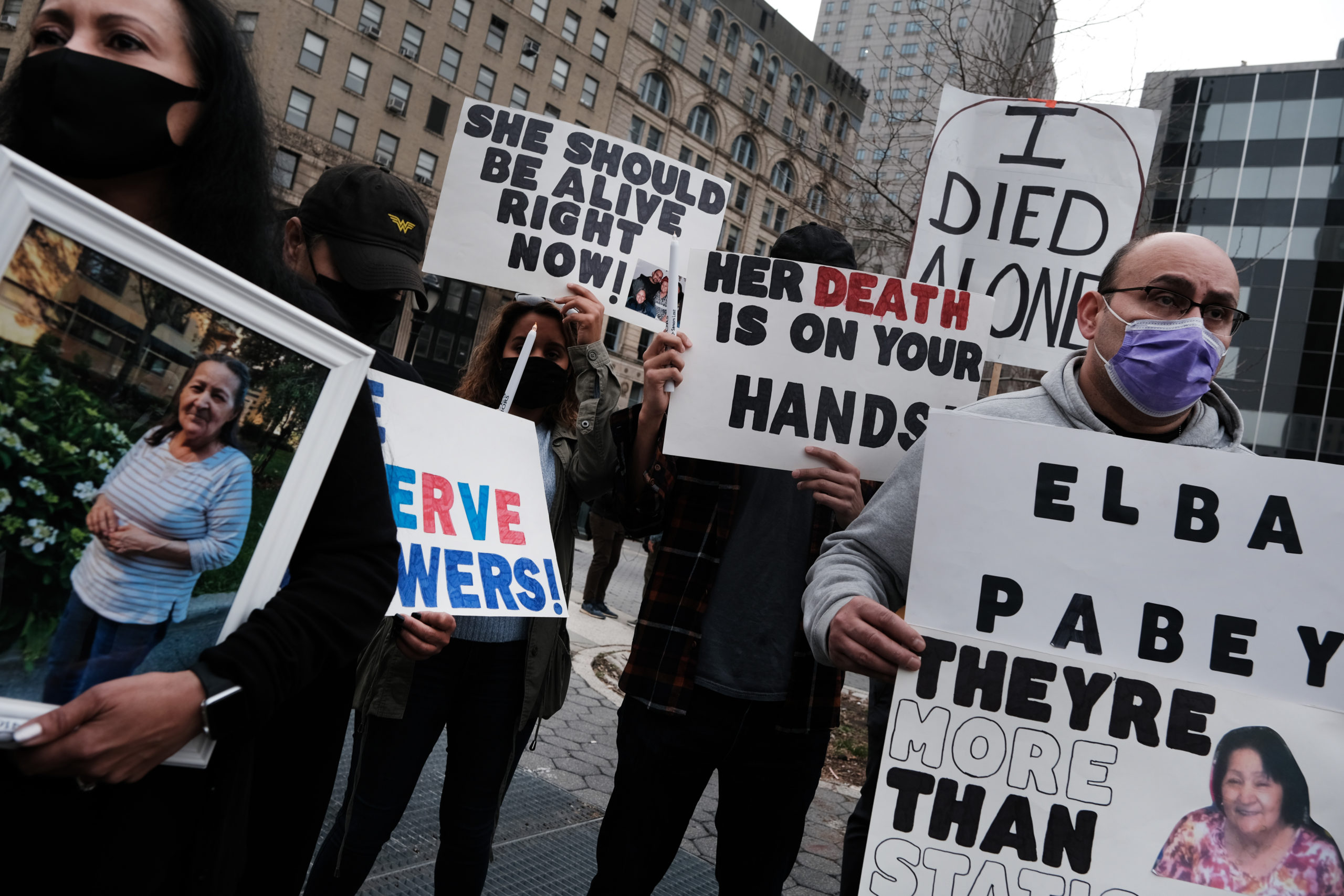 NEW YORK, NEW YORK - MARCH 25: People who've lost loved ones due to Covid-19 while they were in New York nursing homes attend a protest and vigil on March 25, 2021 in New York City. As of this month, New York has recorded the deaths of more than 15,000 nursing home residents with Covid-19. Governor Andrew Cuomo and his administration are being investigated by the F.B.I. on whether they gave false data on nursing homes deaths. (Photo by Spencer Platt/Getty Images)