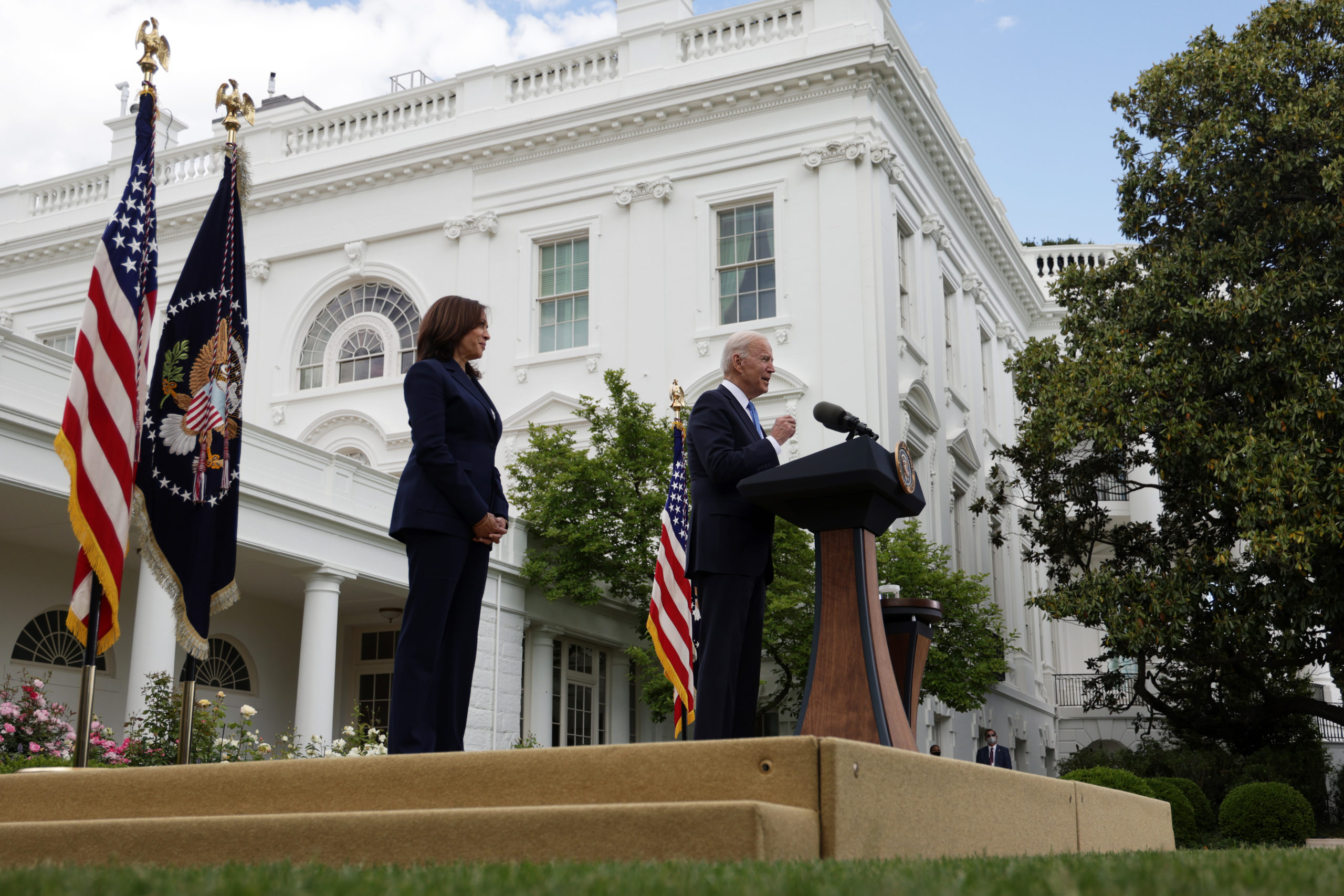 WASHINGTON, DC - MAY 13: U.S. President Joe Biden delivers remarks on the COVID-19 response and vaccination program as Vice President Kamala Harris listens in the Rose Garden of the White House on May 13, 2021 in Washington, DC. The Centers for Disease Control and Prevention (CDC) announced today that fully vaccinated people will no longer need to wear masks or socially distance for indoor and outdoor activities in most settings. (Photo by Alex Wong/Getty Images)