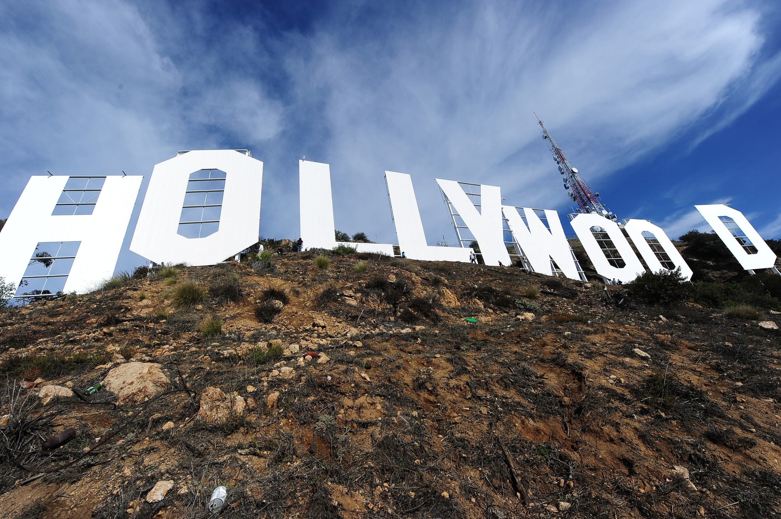 The freshly painted Hollywood Sign is seen after a press conference to announce the completion of the famous landmark's major makeover, December 4, 2012 in Hollywood, California. Some 360 gallons (around 1,360 liters) of paint and primer were used to provide the iconic sign with it most extensive refurbishment in almost 35 years in advance of it's 90th birthday next year. AFP PHOTO / Robyn Beck (Photo by Robyn BECK / AFP) (Photo by ROBYN BECK/AFP via Getty Images)