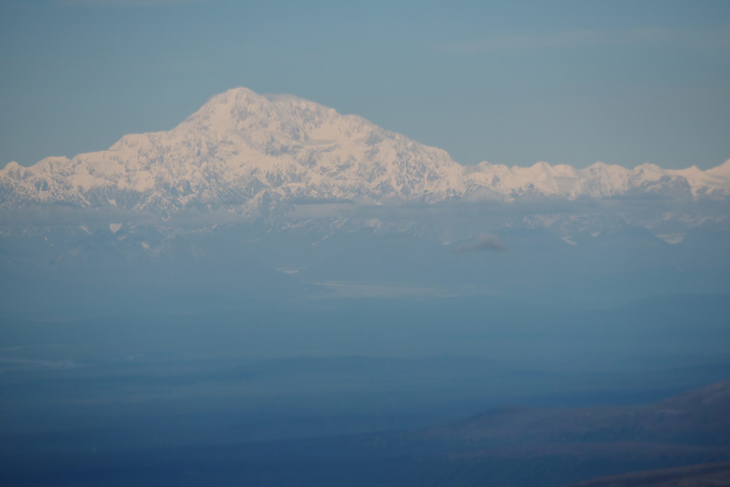 A photo taken from Air Force One shows Denali which was formerly known as Mount McKinley on August 31, 2015. US President Barack is to announce the restoration of the Koyukon Athabascan name of "Denali" to the tallest mountain in North America. AFP PHOTO/Mandel NGAN (Photo credit should read MANDEL NGAN/AFP via Getty Images)