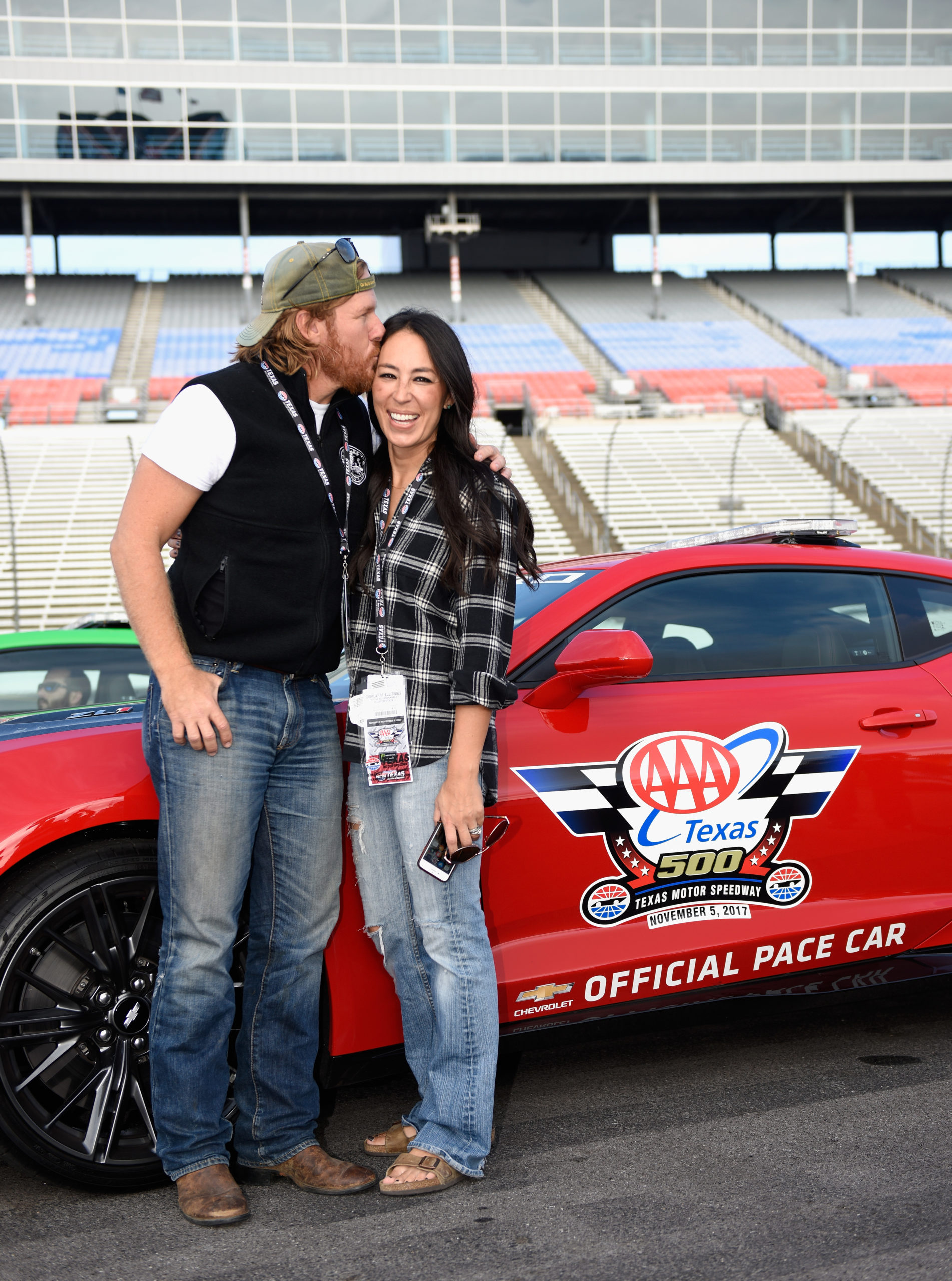'Fixer Upper' stars Chip and Joanna Gaines pose with the Monster Energy NASCAR Cup Series AAA Texas 500 pace car at Texas Motor Speedway on November 5, 2017 in Fort Worth, Texas. (Photo by Jared C. Tilton/Getty Images)