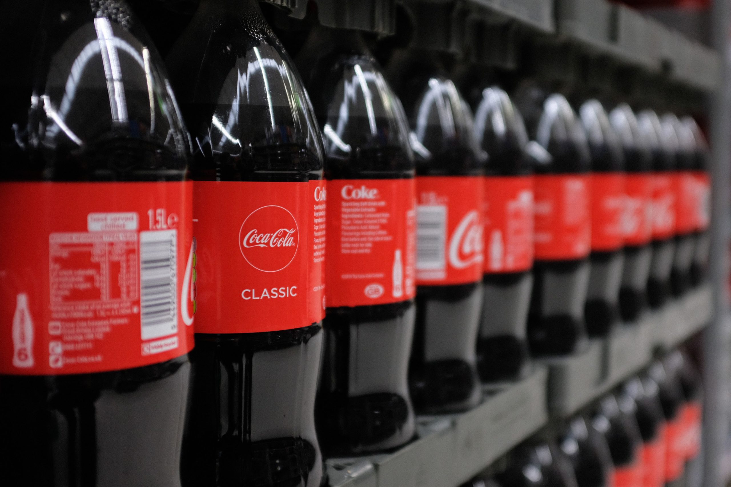 Bottles of Coca-Cola are pictured at a branch of Asda in north London, on April 27, 2018. - 42 firms, responsible for 80 percent of plastic packaging sold in Britain, have signed up to a pact that aims to tackle plastic pollution over the next seven years through a series of measures. (Photo by Daniel LEAL-OLIVAS / AFP) (Photo credit should read DANIEL LEAL-OLIVAS/AFP via Getty Images)