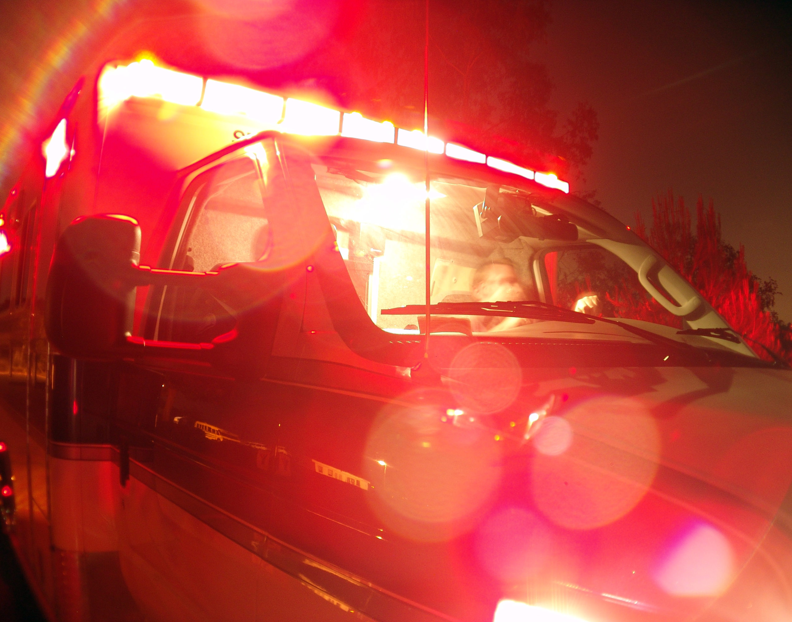 Ambulance with lights on [Shutterstock]