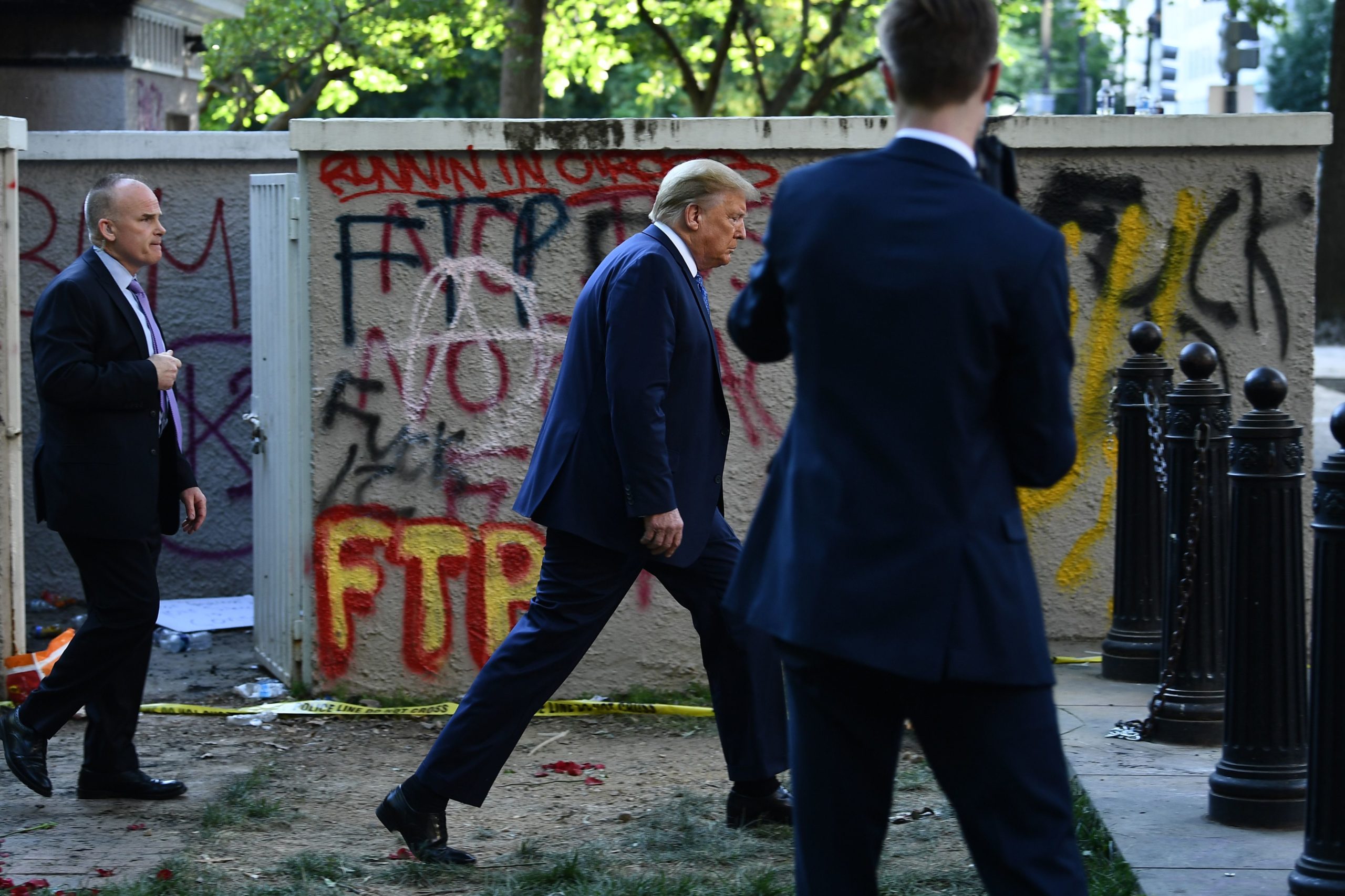 US President Donald Trump walks back to the White House escorted by the Secret Service after appearing outside of St John's Episcopal church across Lafayette Park in Washington, DC on June 1, 2020. - US President Donald Trump was due to make a televised address to the nation on Monday after days of anti-racism protests against police brutality that have erupted into violence. The White House announced that the president would make remarks imminently after he has been criticized for not publicly addressing in the crisis in recent days. (Photo by Brendan Smialowski / AFP) (Photo by BRENDAN SMIALOWSKI/AFP via Getty Images)