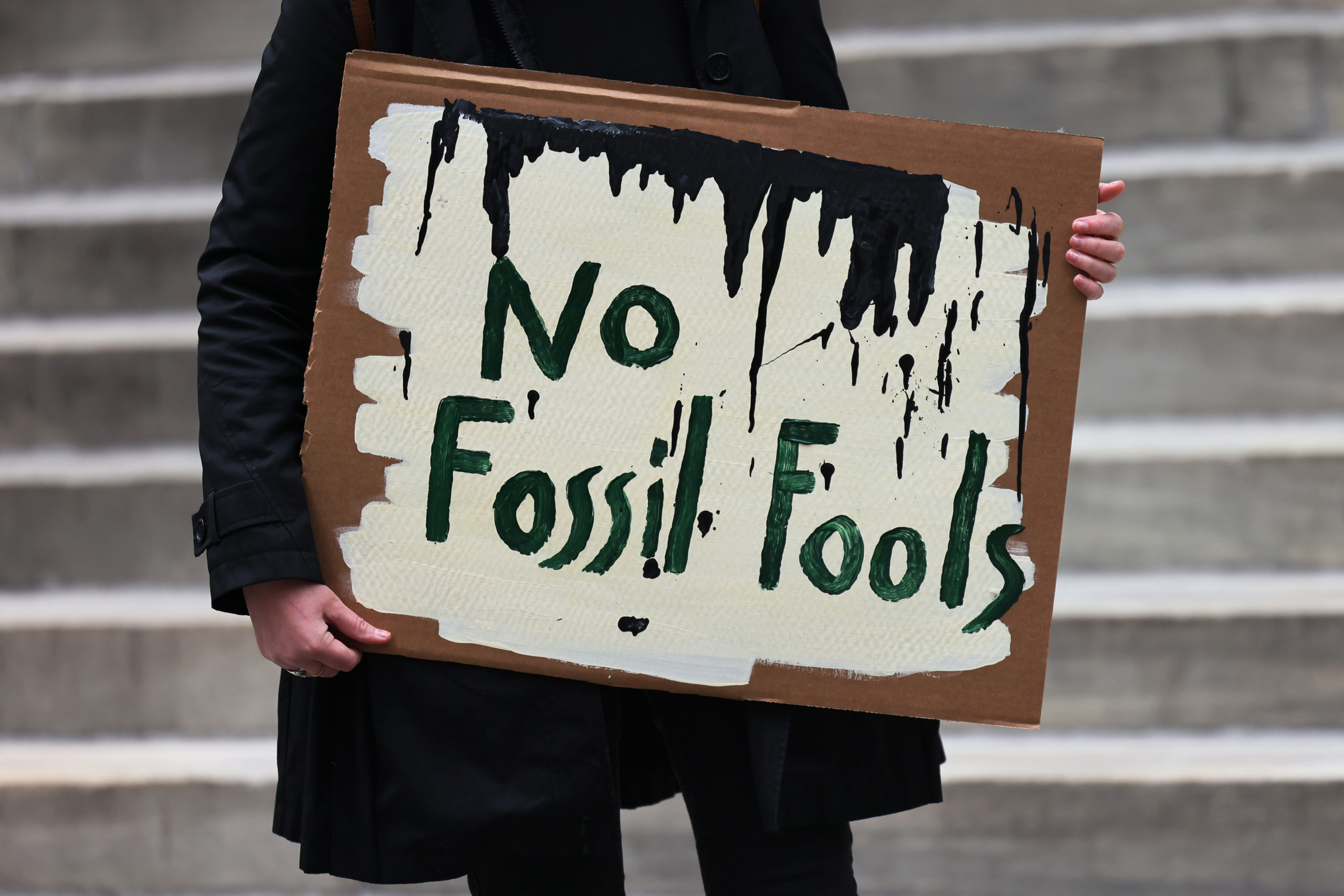 A protester holds an anti-pipeline sign during an April rally in New York City. (Michael M. Santiago/Getty Images)