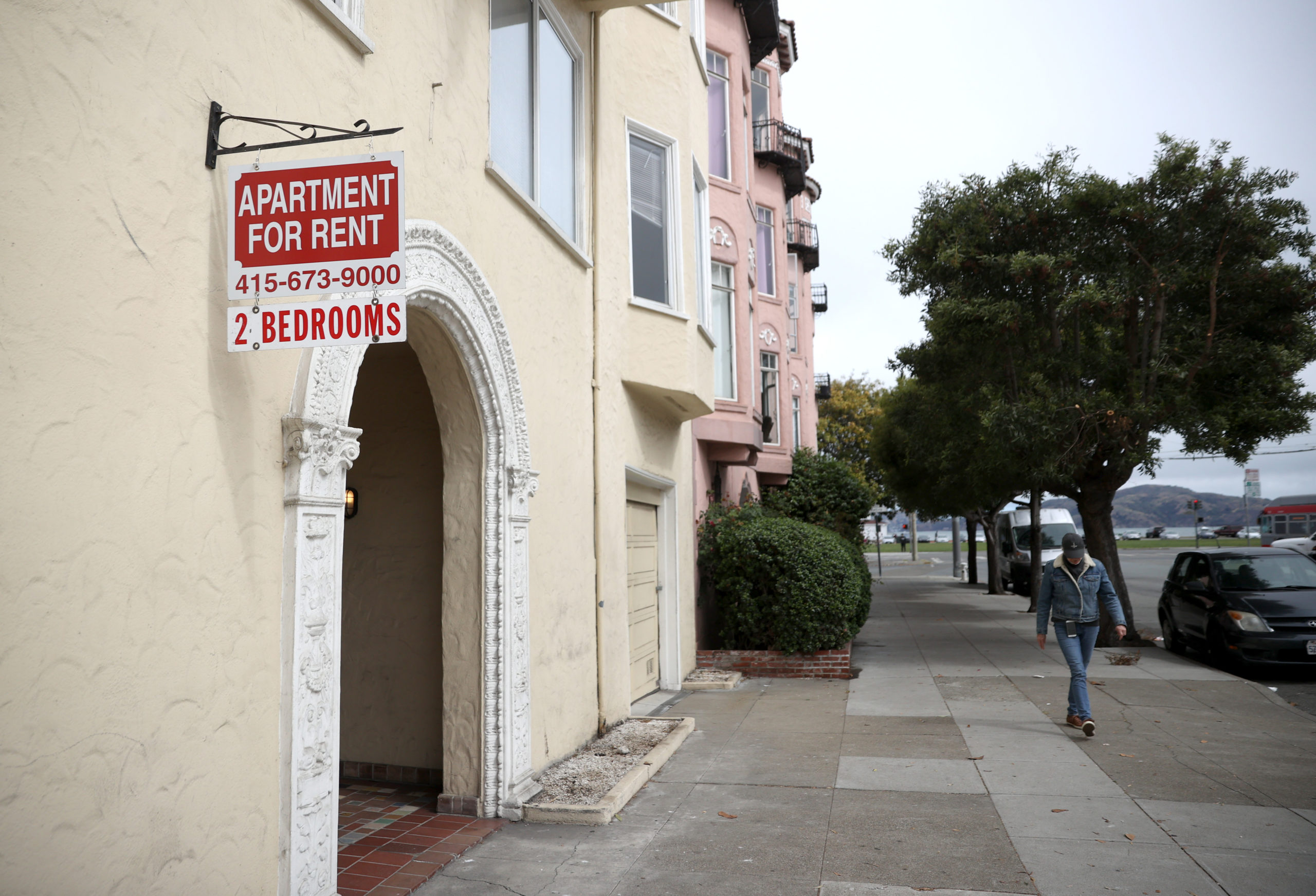 SAN FRANCISCO, CALIFORNIA - JUNE 02: A pedestrian walks by a "for rent" sign posted in front of an apartment building on June 02, 2021 in San Francisco, California. After San Francisco rental prices plummeted during the pandemic shutdown, prices have surged back to pre-pandemic levels. (Photo by Justin Sullivan/Getty Images)