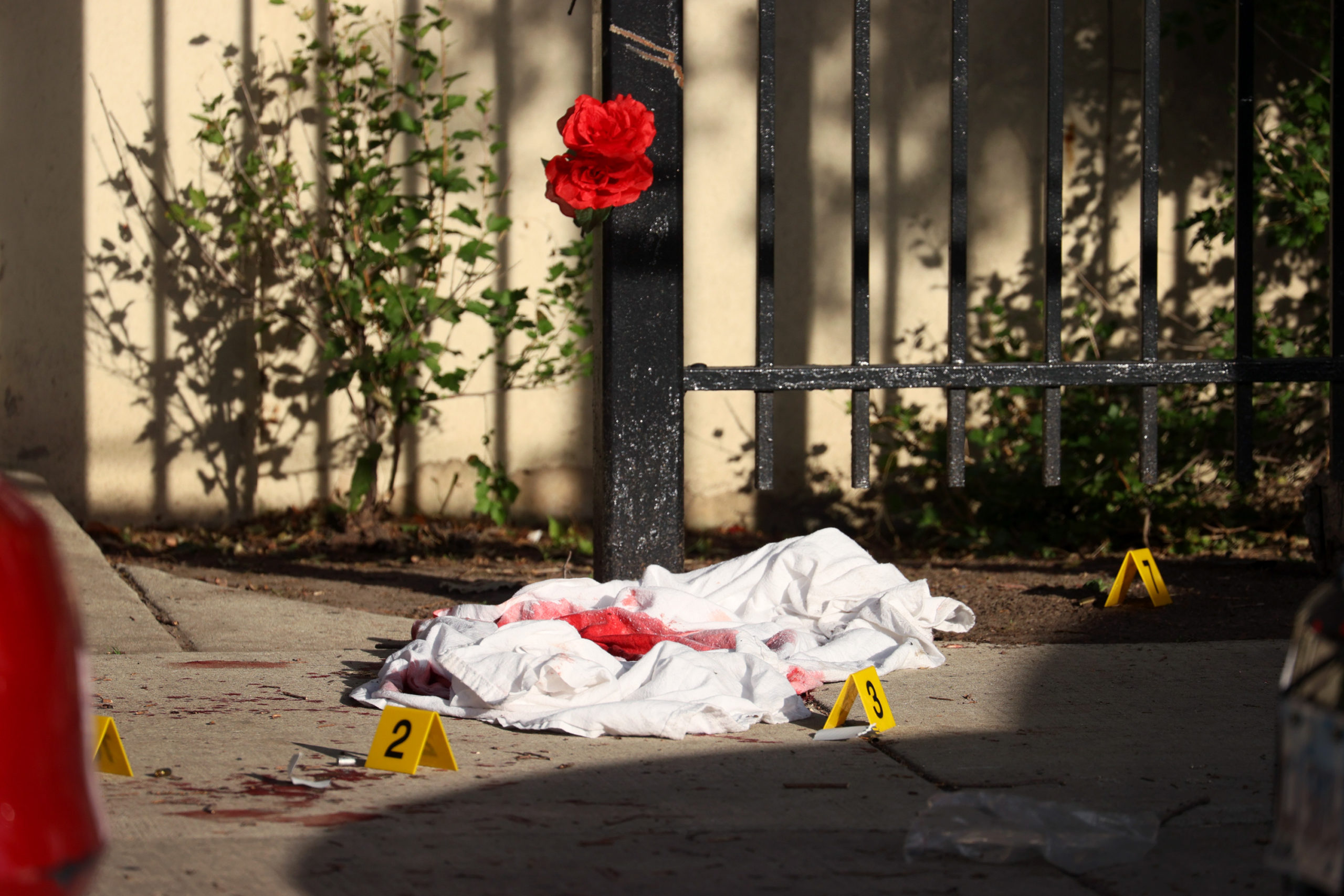 A blood-soaked sheet sits among evidence markers following a mass shooting on June 23 in Chicago, Illinois. (Scott Olson/Getty Images)