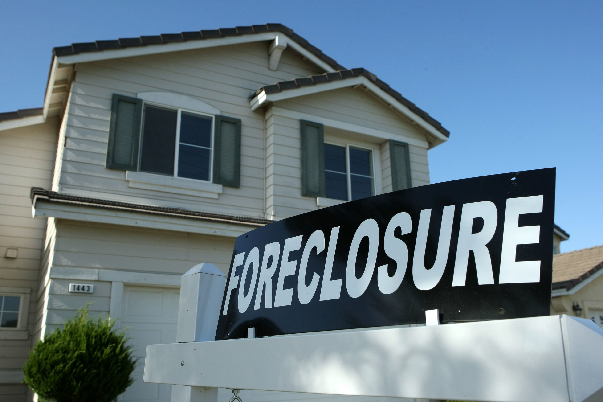 STOCKTON, CA - APRIL 29: A foreclosure sign sits in front of a home for sale April 29, 2008 in Stockton, California. As the nation continues to see widespread home loan foreclosures, Stockton, California led the nation with the highest foreclosure rate. One out of every 30 homes in Stockton is in foreclosure, close to seven times the national average for a metro area in the U.S. (Photo by Justin Sullivan/Getty Images)