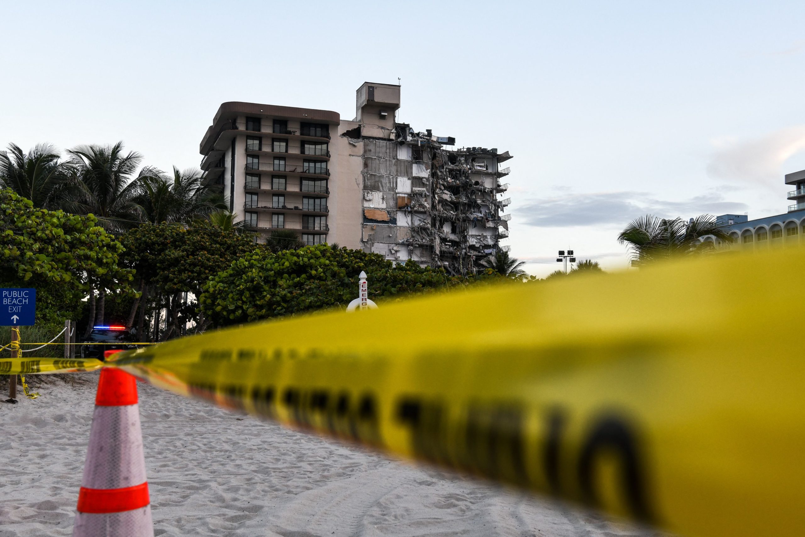 Police tape blocks access to a partially collapsed building in Surfside north of Miami Beach, on June 24, 2021. (Photo by CHANDAN KHANNA/AFP via Getty Images)