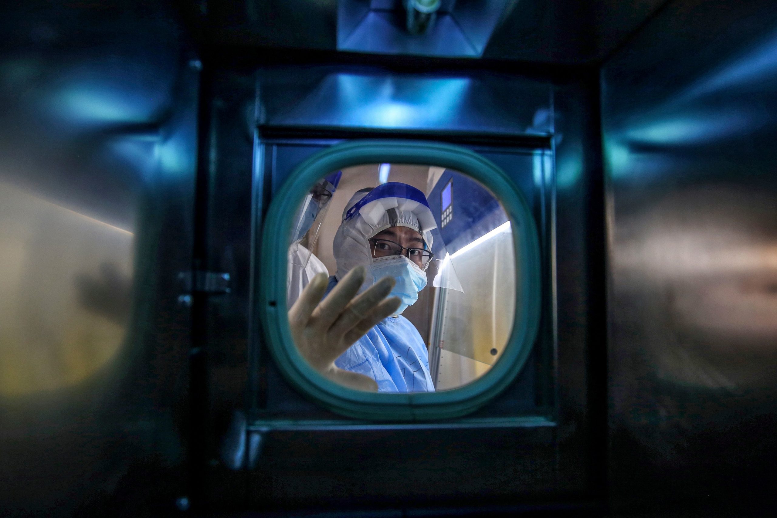 A medical staff member gestures inside an isolation ward at Red Cross Hospital in Wuhan, China on March 10, 2020. (STR/AFP via Getty Images)