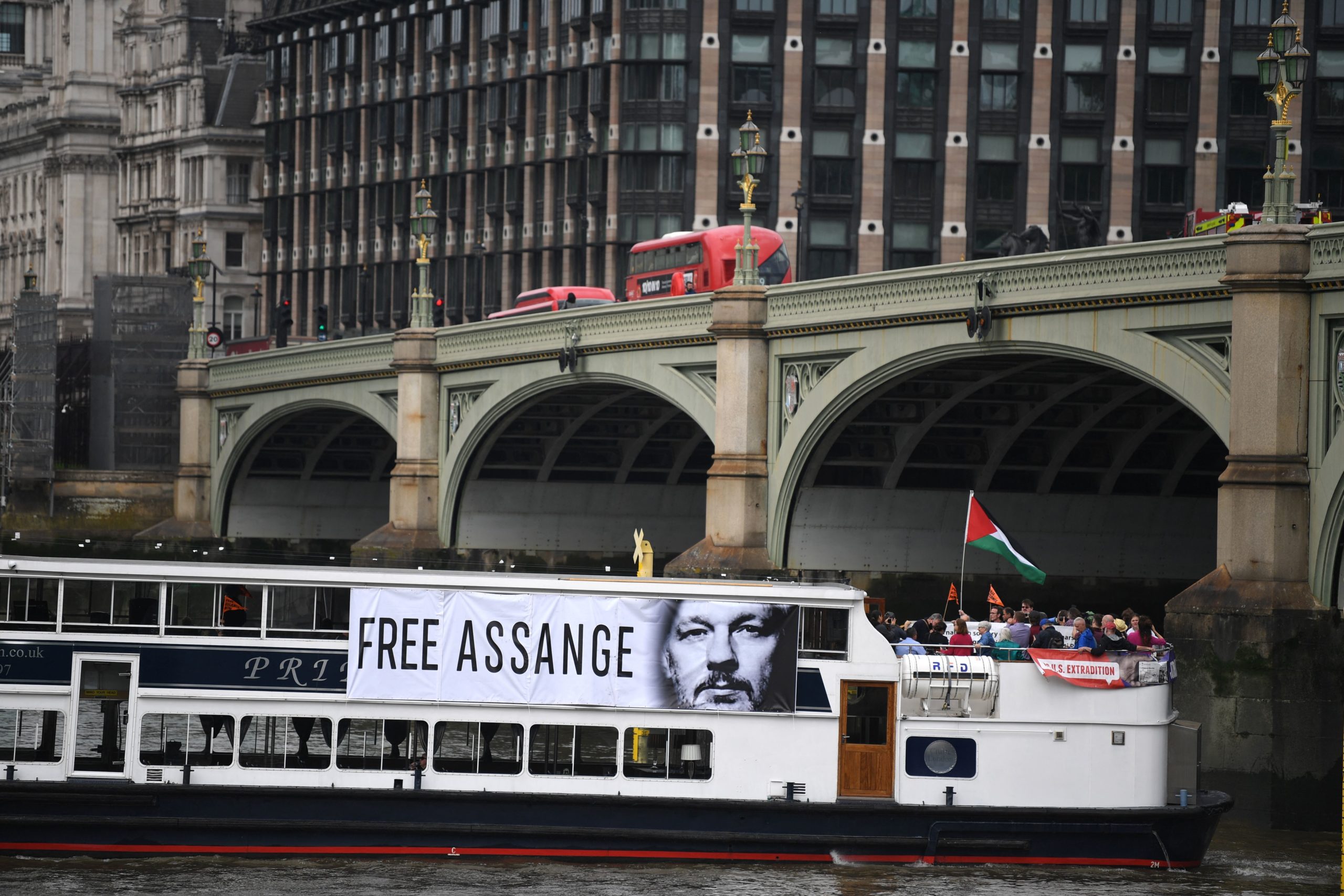 Supporters of Wikileaks founder Julian Assange sail down the river Thames on July 1. (Daniel Leal-Olivas/AFP via Getty Images)