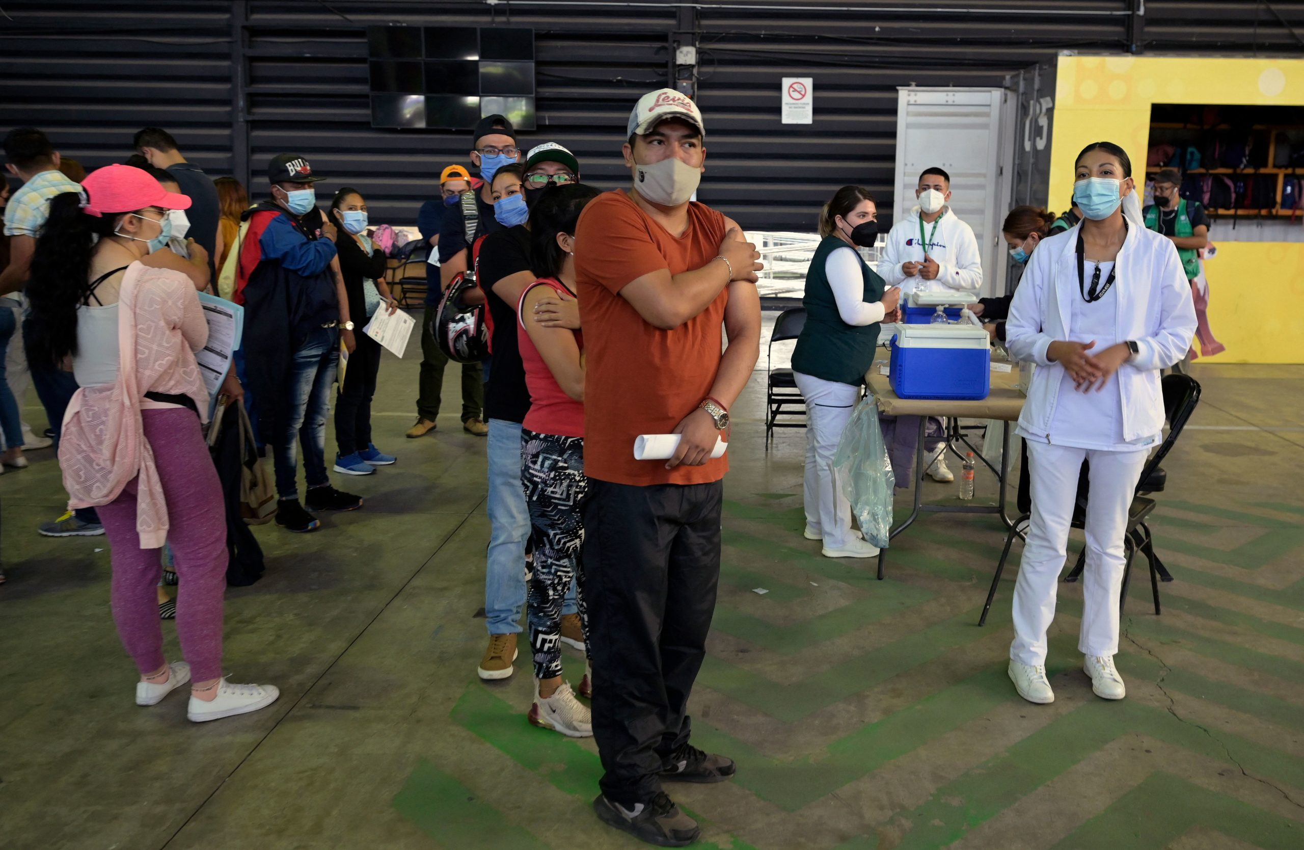 People in the range of 30 to 39 years old are seen after receiving their first dose of the AstraZeneca vaccine against Covid-19, at the Palacio de los Deportes in Mexico City, on July 13, 2021. (Photo by ALFREDO ESTRELLA/AFP via Getty Images)