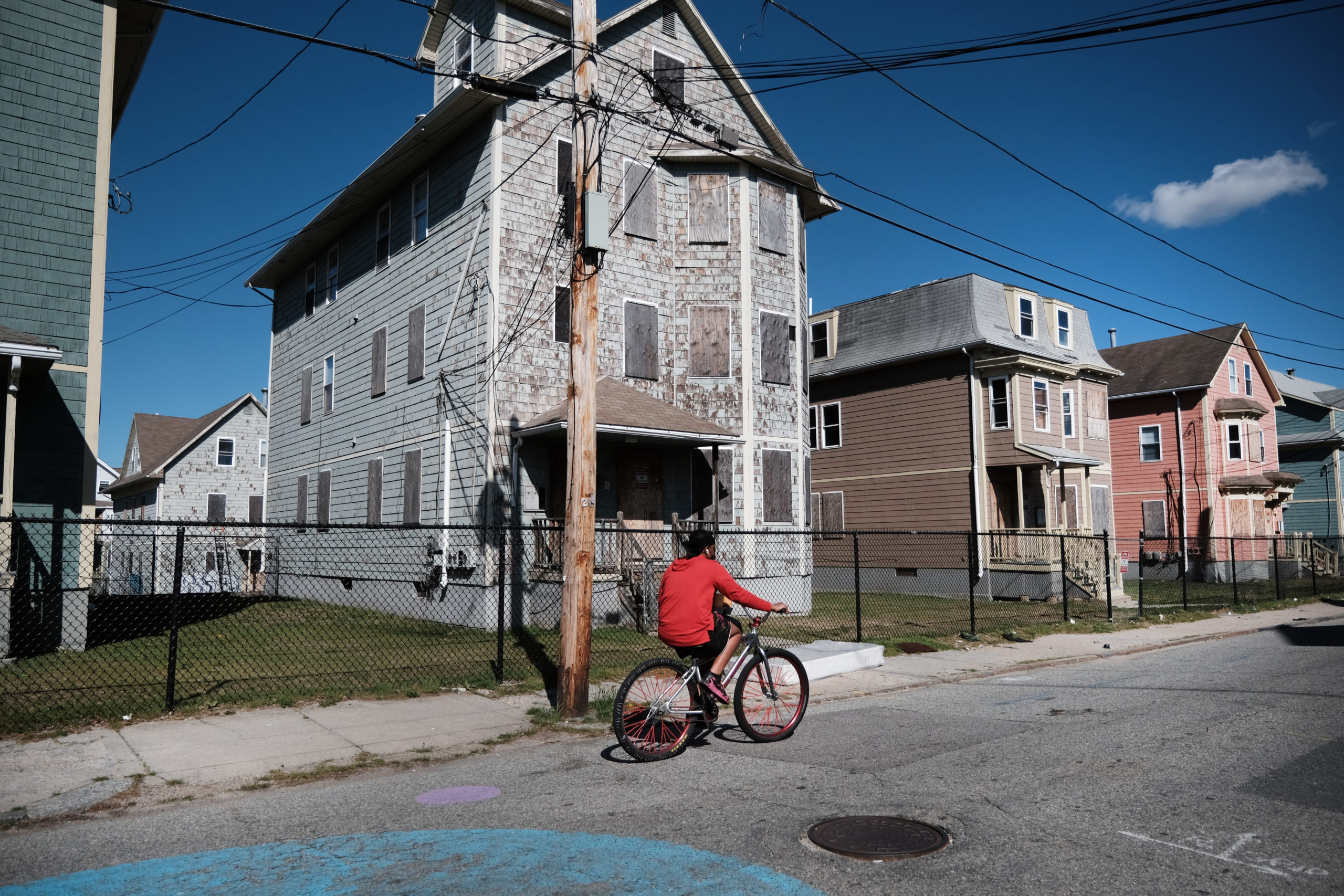 PROVIDENCE, RHODE ISLAND-APRIL 08: Homes are shown boarded up on April 08, 2021 in Providence, Rhode Island. Rhode Island in 2019 ranked worst among the 50 states in the condition of its infrastructure, and consistently ranks among the bottom, with an estimated 24 percent of its roads in poor condition and 23 percent of its bridges standing structurally deficient. Looking to reshape the U.S. economy, President Joe Biden unveiled a $2-trillion jobs, infrastructure and green energy plan called the American Jobs Plan. The administration says the proposal would create tens of thousands of jobs in construction, clean energy and technology. Many economists, engineers and politicians believe that infrastructure in the U.S. lags behind China and other leading nations. (Photo by Spencer Platt/Getty Images)
