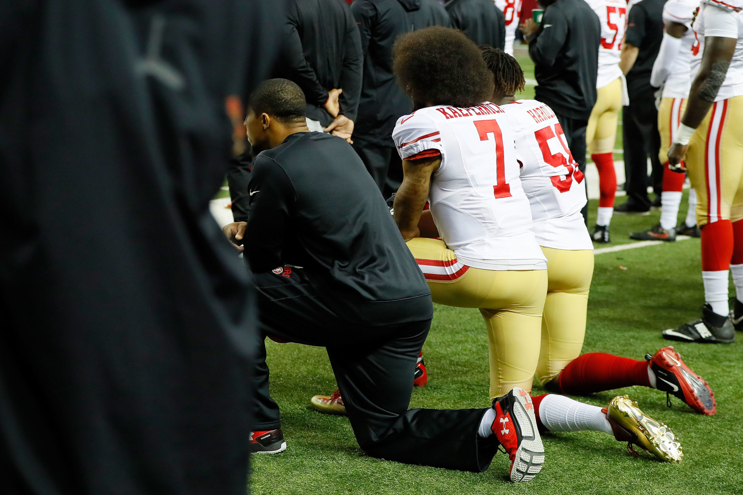 Colin Kaepernick of the San Francisco 49ers and Eli Harold kneel during the National Anthem. (Photo by Kevin C. Cox/Getty Images)