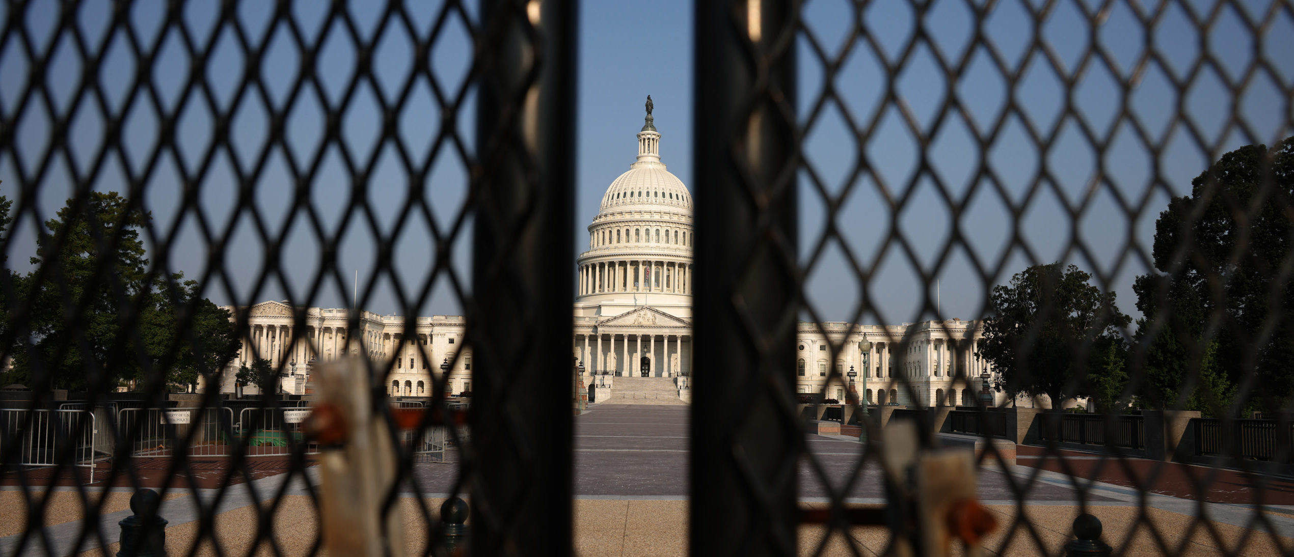 WASHINGTON, DC - JULY 06: The U.S. Capitol is seen behind security fencing on July 06, 2021 in Washington, DC. According to recent media reports, the remaining fencing that has surrounded the U.S. Capitol following the January 6 riot will come down sometime this week. (Photo by Anna Moneymaker/Getty Images)