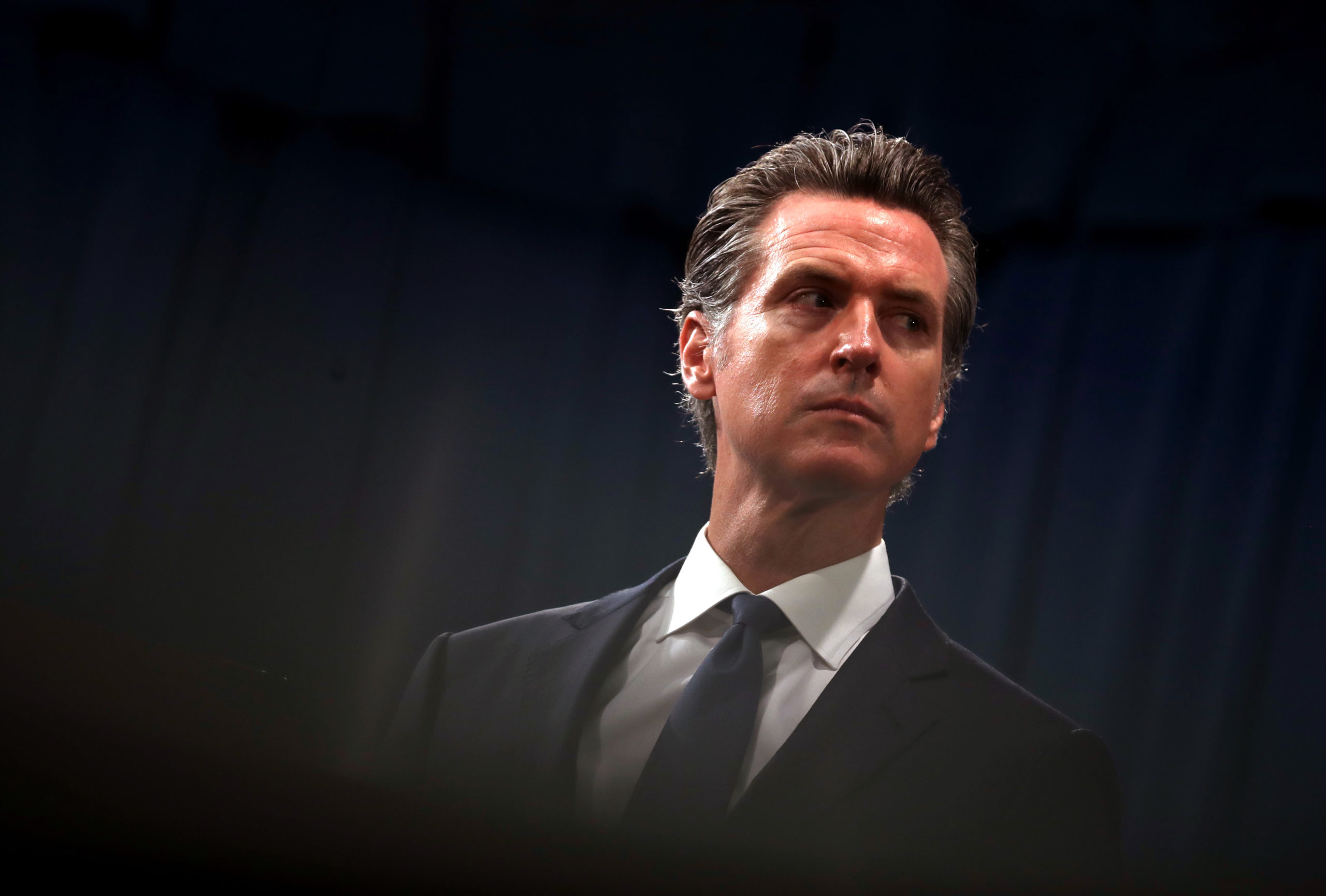 SACRAMENTO, CALIFORNIA - AUGUST 16: California Gov. Gavin Newsom looks on during a news conference with California attorney General Xavier Becerra at the California State Capitol on August 16, 2019 in Sacramento, California. California attorney genera Xavier Becerra and California Gov. Gavin Newsom announced that the State of California is suing the Trump administration challenging the legality of a new "public charge" rule that would make it difficult for immigrants to obtain green cards who receive public assistance like food stamps and Medicaid. (Photo by Justin Sullivan/Getty Images)