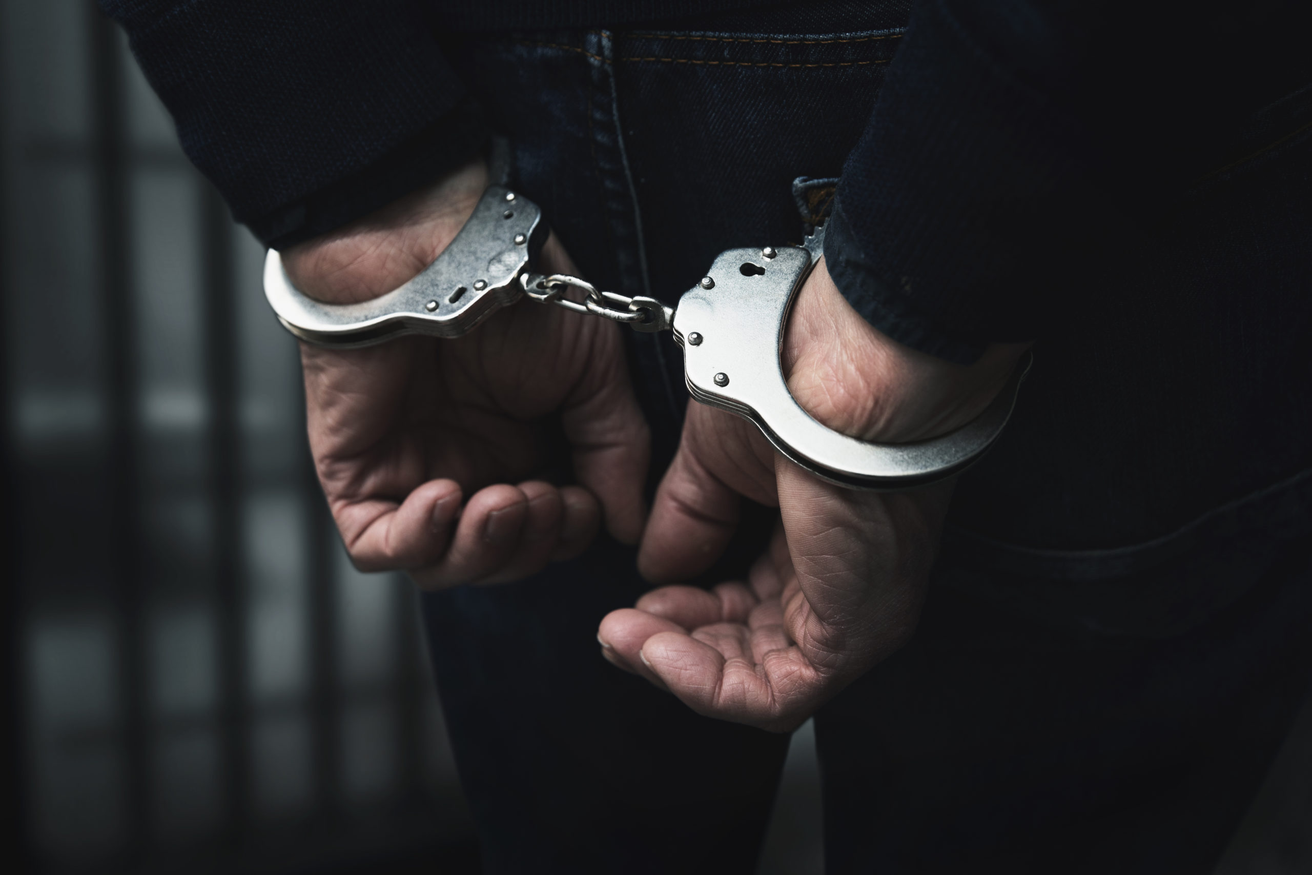 Arrested man with handcuffs. This image does not depict the individual mentioned in the story. [Ronstik/Shutterstock]