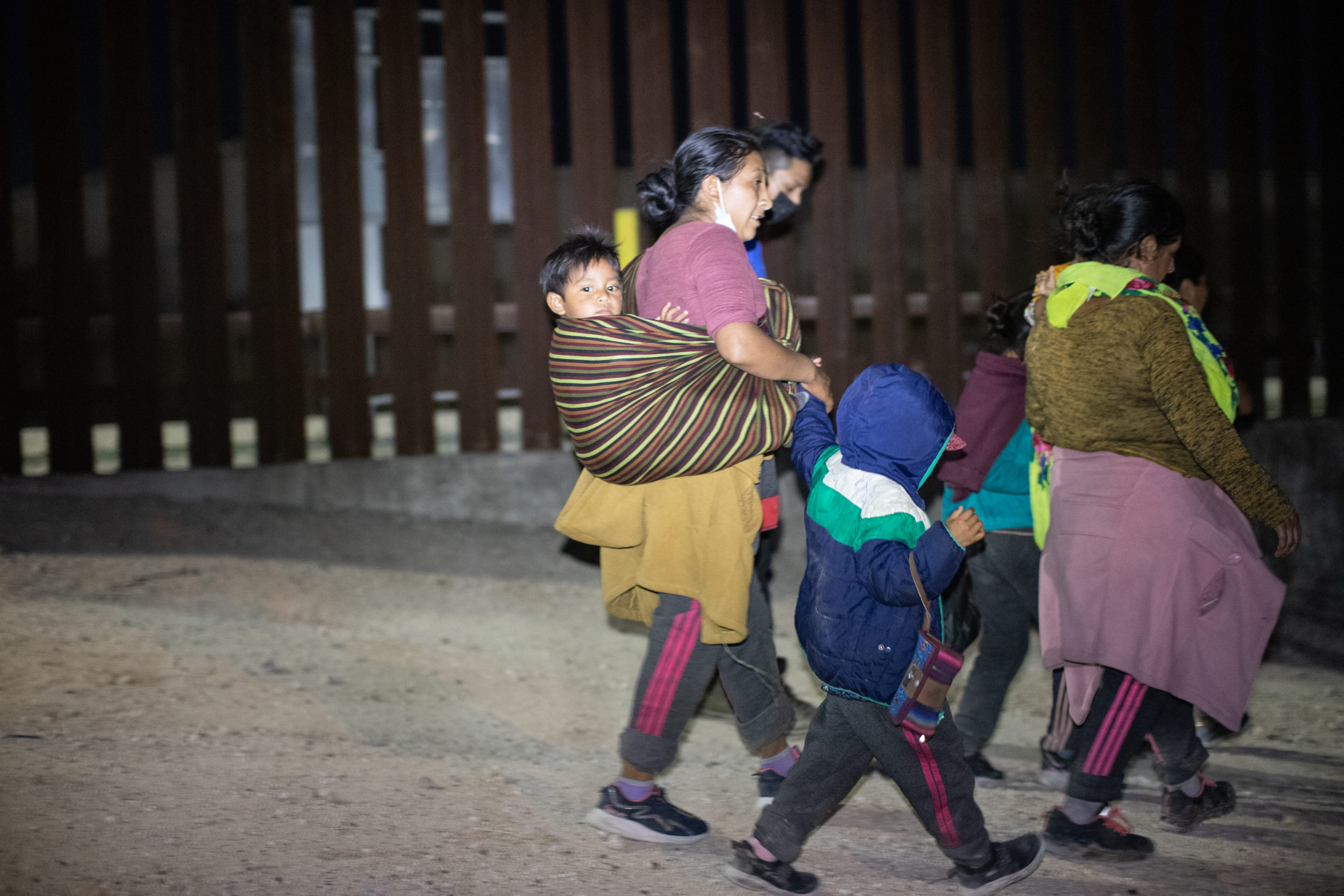 A group of migrants sought out law enforcement officials so they could turn themselves in and try to apply for asylum near the Hidalgo Point of Entry on August 9, 2021. (Kaylee Greenlee - Daily Caller News Foundation)