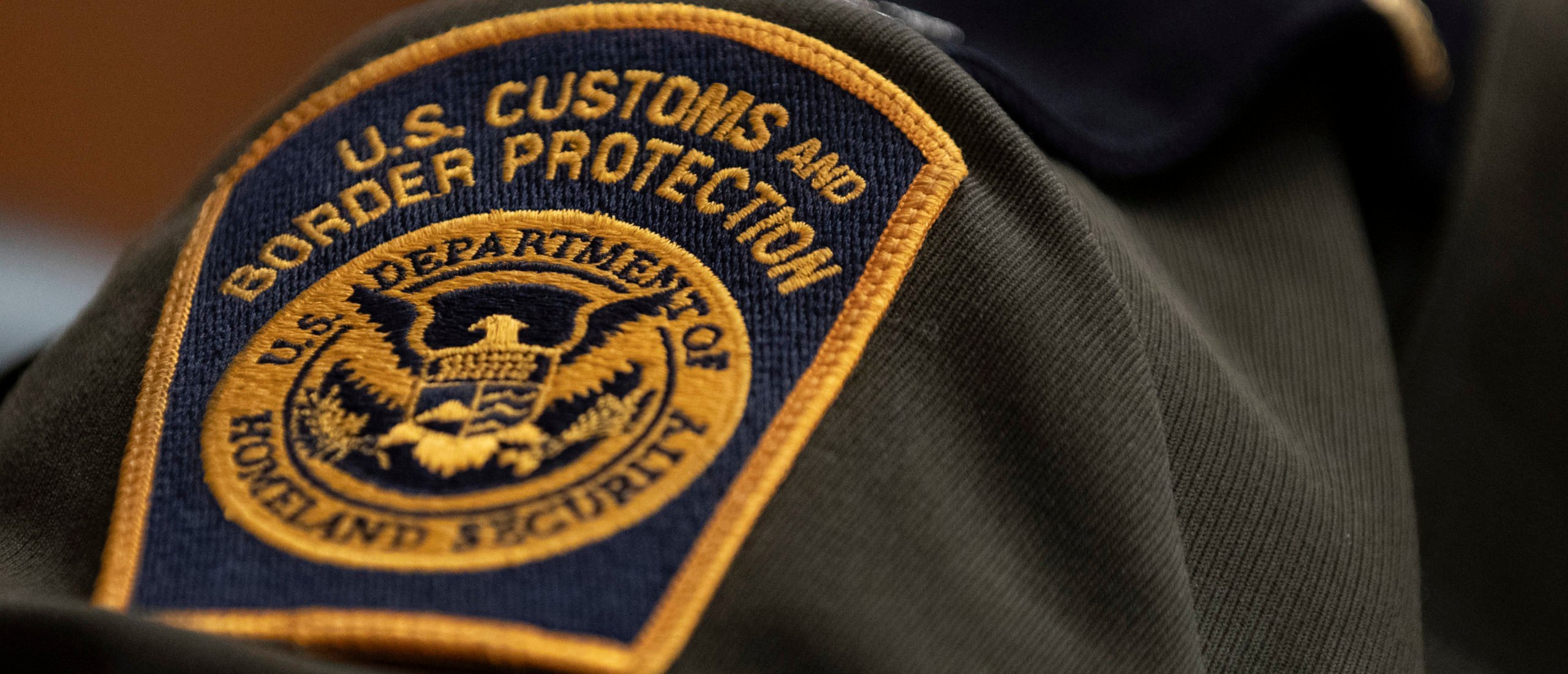 WASHINGTON, DC - APRIL 09: A U.S. Customs and Border Protection patch on the uniform of Rodolfo Karisch, Rio Grande Valley sector chief patrol agent for the U.S. Border Patrol, as he testifies during a U.S. Senate Homeland Security Committee hearing on migration on the Southern U.S Border on April 9, 2019 in Washington, DC. During the hearing, lawmakers questioned witnesses about child mentions, minor reunification, and illegal drug seizures on the Southern Border. (Photo by Alex Edelman/Getty Images)
