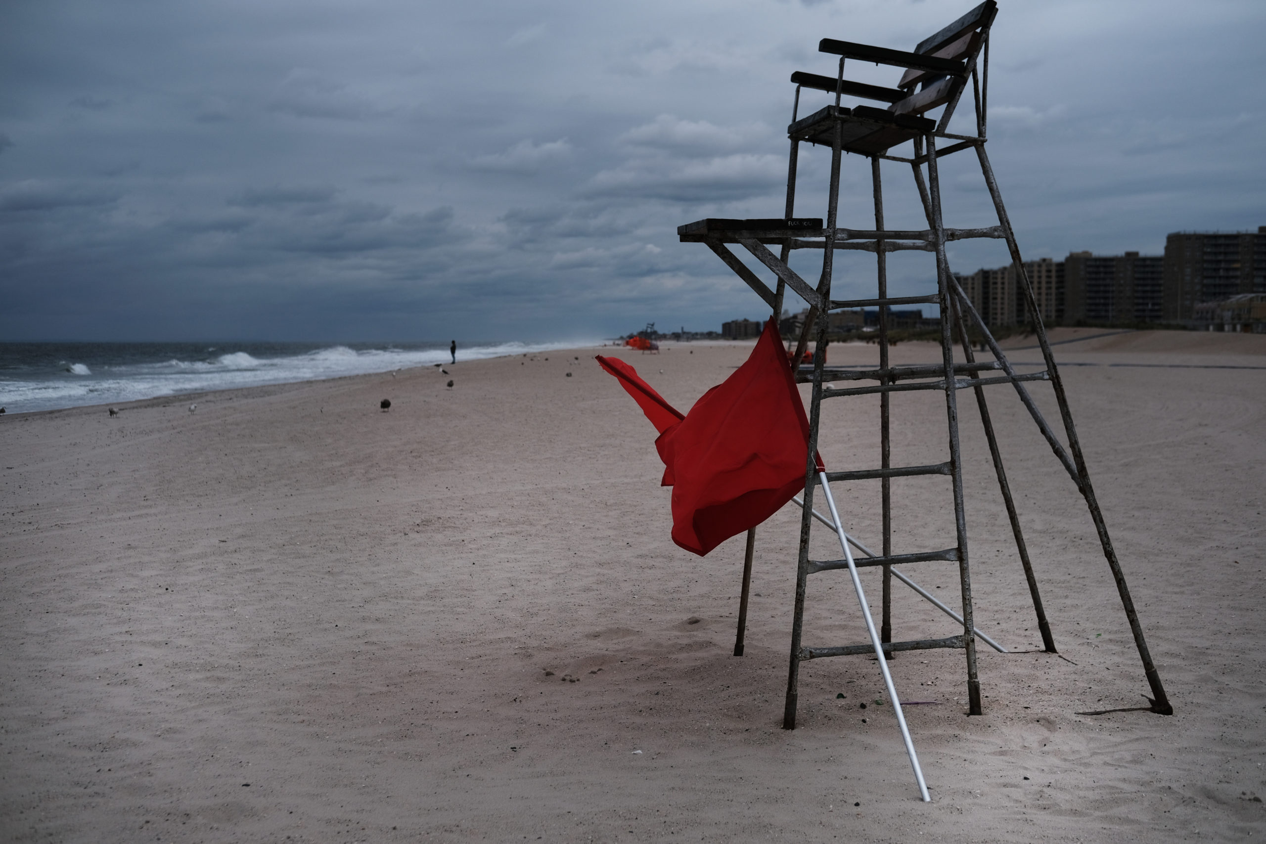 NEW YORK, NEW YORK - SEPTEMBER 06: An empty lifeguard chair stands at Rockaway Beach as swimming and surfing is temporarily banned due to strong rip currents from Hurricane Dorian on September 06, 2019 in New York City. The massive hurricane that devastated the Bahamas, has weakened to a category 1 storm after making landfall over Cape Hatteras. (Photo by Spencer Platt/Getty Images)