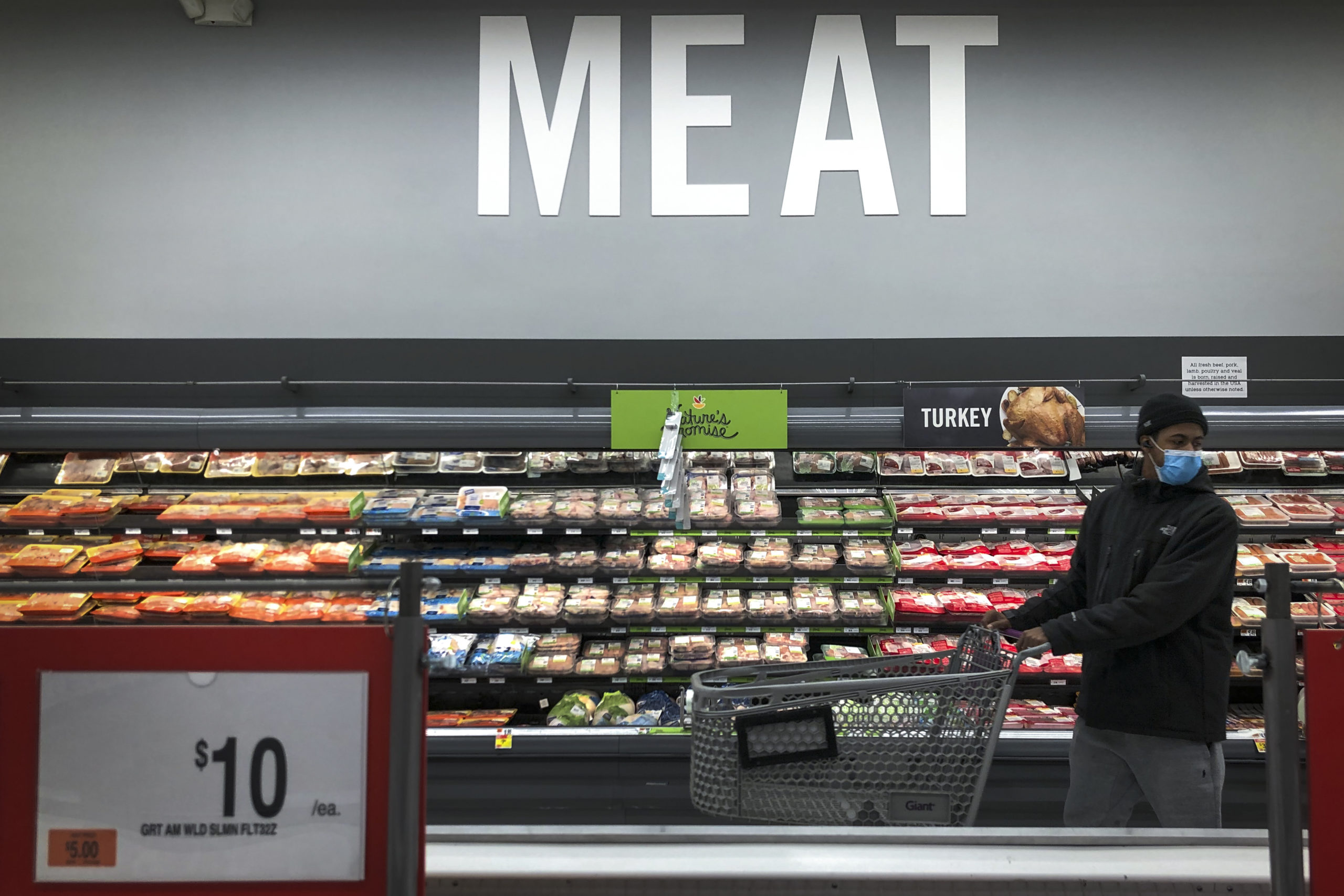A man shops in the meat section at a grocery store in Washington, D.C. last year. (Drew Angerer/Getty Images)