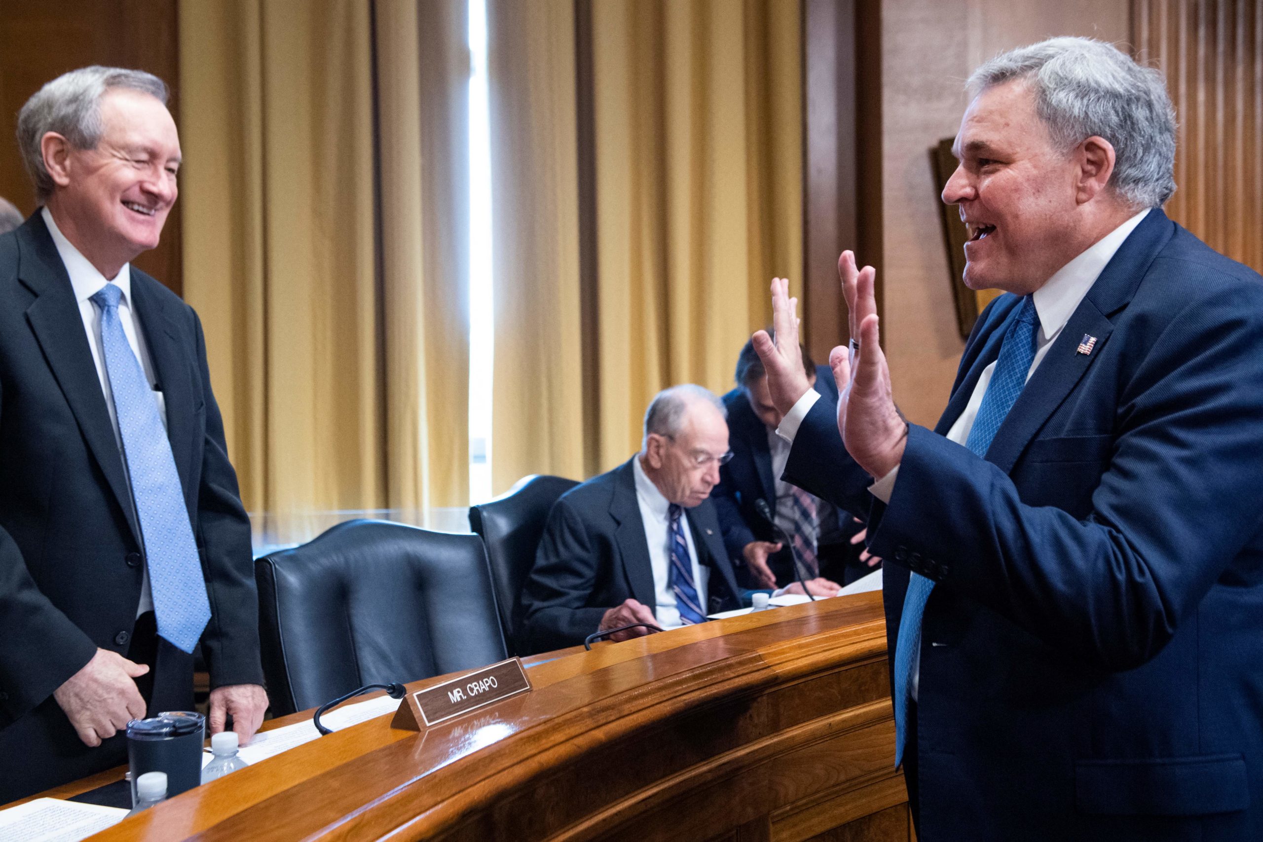 IRS Commissioner Charles Rettig greets Ranking Member Sen. Mike Crapo before a June 8 hearing. (Tom Williams/Pool/AFP via Getty Images)