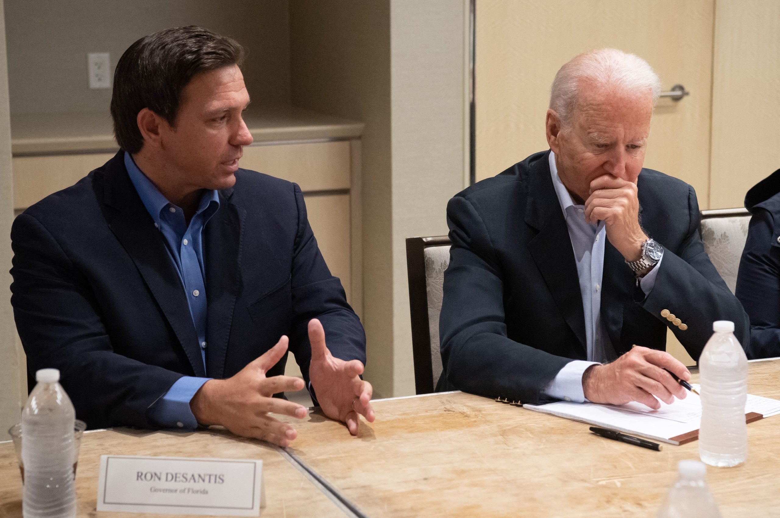 US President Joe Biden alongside Florida Governor Ron DeSantis (L) speaks about the collapse of the 12-story Champlain Towers South condo building in Surfside, during a briefing in Miami Beach, Florida, July 1, 2021. (Photo by SAUL LOEB/AFP via Getty Images)