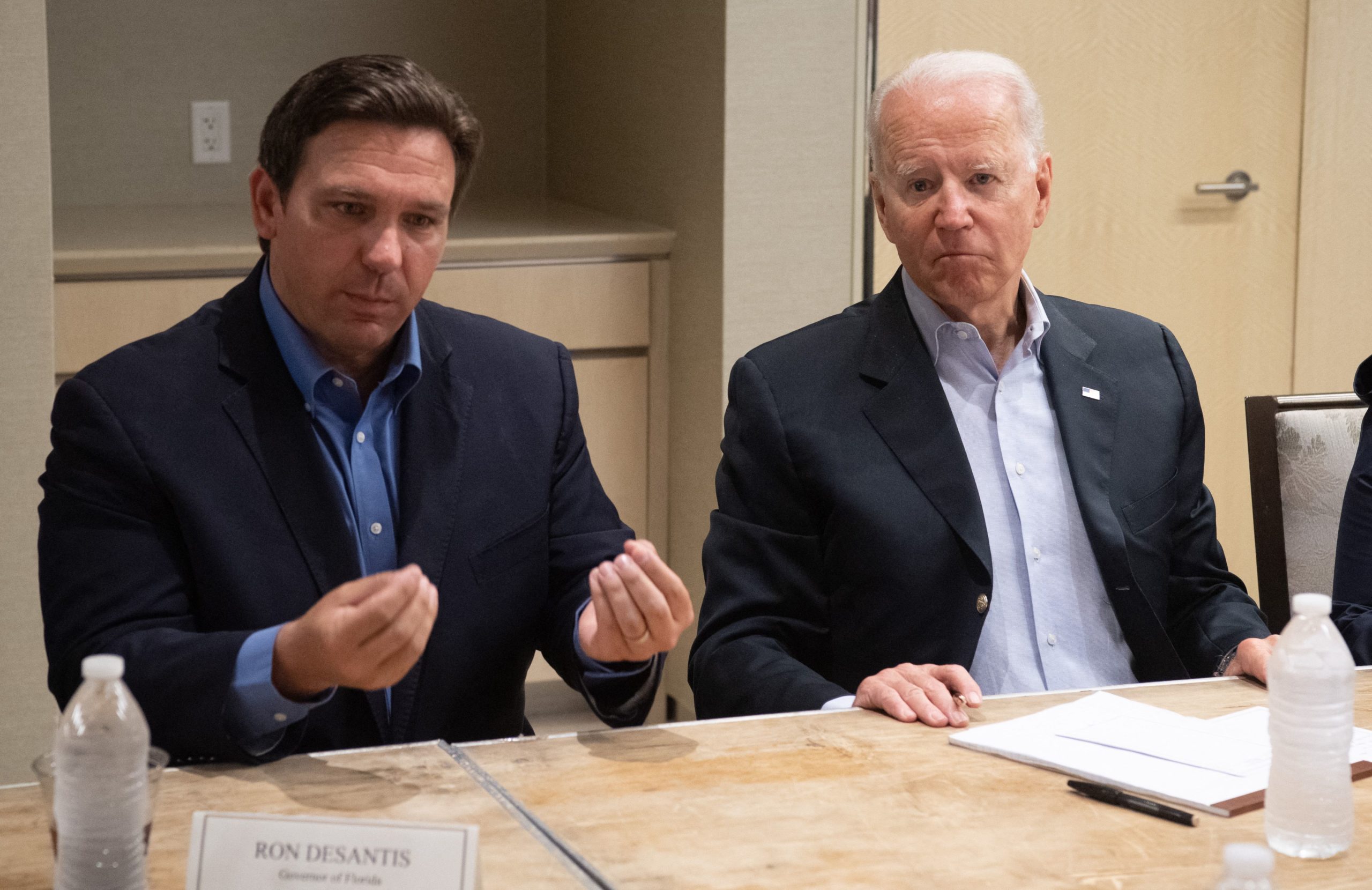 US President Joe Biden alongside Florida Governor Ron DeSantis (L) speaks about the collapse of the 12-story Champlain Towers South condo building in Surfside, during a briefing in Miami Beach, Florida, July 1, 2021. (Photo by SAUL LOEB / AFP) (Photo by SAUL LOEB/AFP via Getty Images)