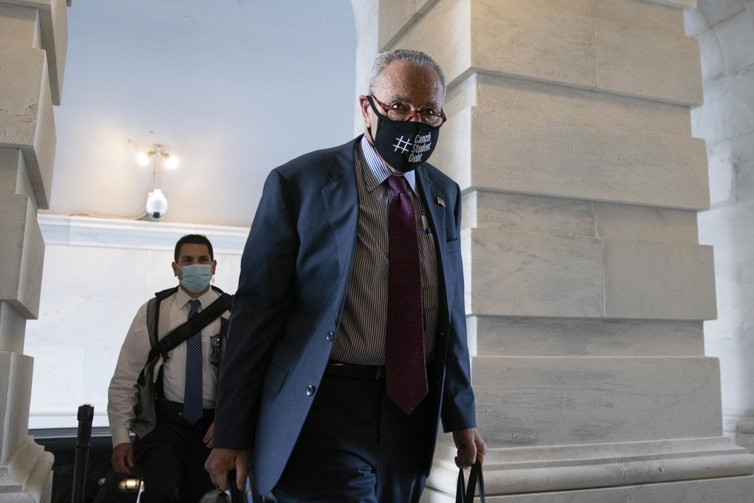 Senate Majority Leader Chuck Schumer arrives at the Capitol Saturday, when the Senate is convening in a rare session to advance its infrastructure bill. (Sarah Silbiger/Getty Images)