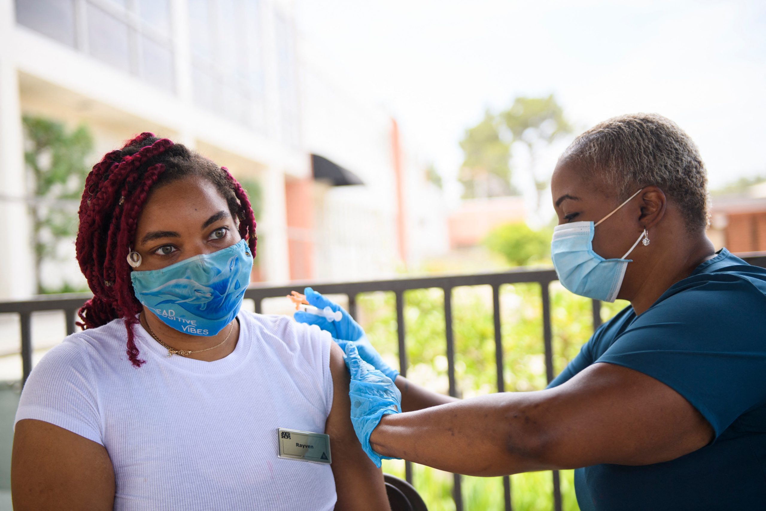 A nurse administers a dose of the Pfizer Covid-19 vaccine to a college student during a City of Long Beach Public Health Covid-19 mobile vaccination clinic at the California State University Long Beach (CSULB) campus on August 11, 2021 in Long Beach, California. (Photo by PATRICK T. FALLON/AFP via Getty Images)
