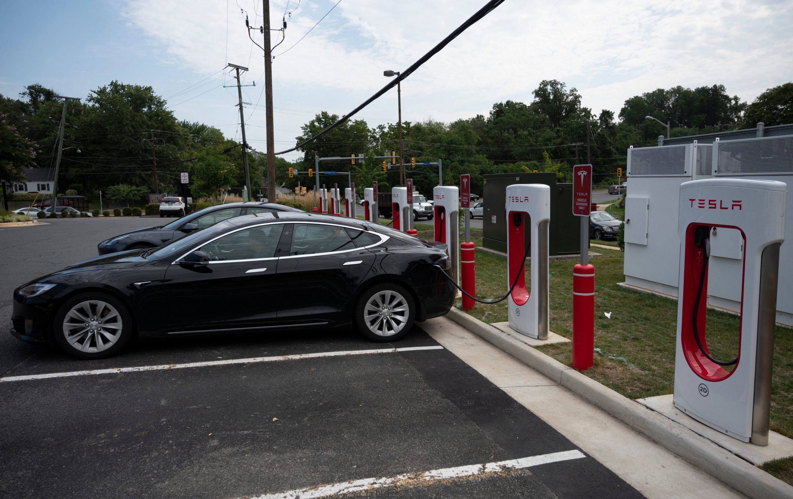 Cars charge at a Tesla super charging station in Arlington, Virginia on Aug. 13. (Andrew Caballero-Reynolds/AFP via Getty Images)