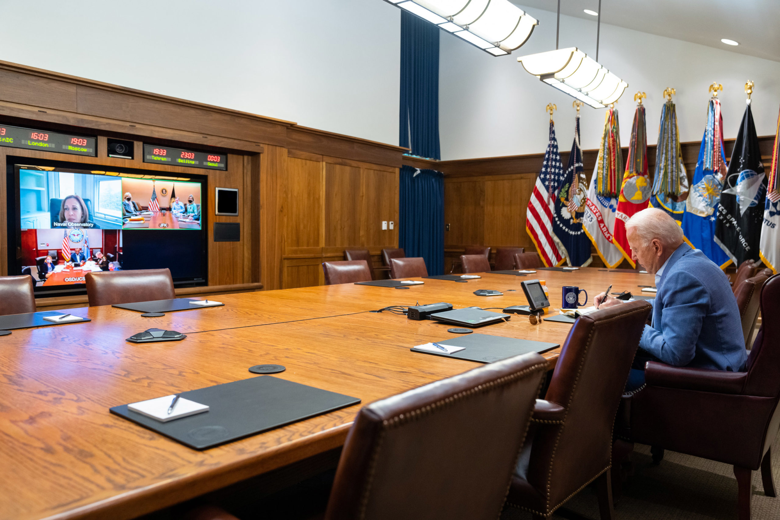 President Joe Biden and Vice President Kamala Harris hold a virtual conference with their national security team on Monday. (White House via Getty Images)