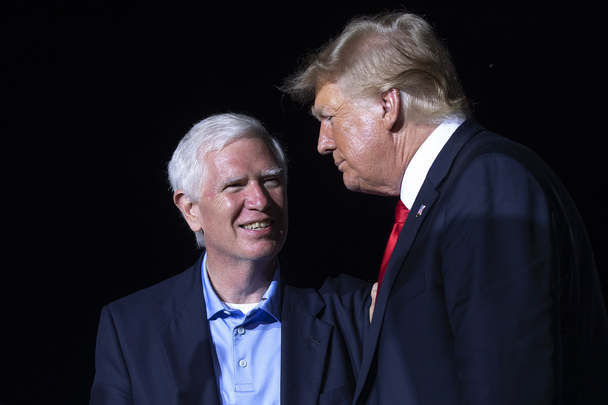 CULLMAN, ALABAMA - AUGUST 21: Former U.S. President Donald Trump (R) welcomes candidate for U.S. Senate and U.S. Rep. Mo Brooks (R-AL) to the stage during a "Save America" rally at York Family Farms on August 21, 2021 in Cullman, Alabama. (Photo by Chip Somodevilla/Getty Images)