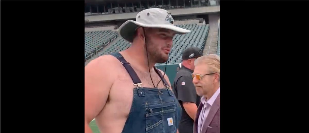 Landon Dickerson wears Overalls with no shirt for pregame outfit