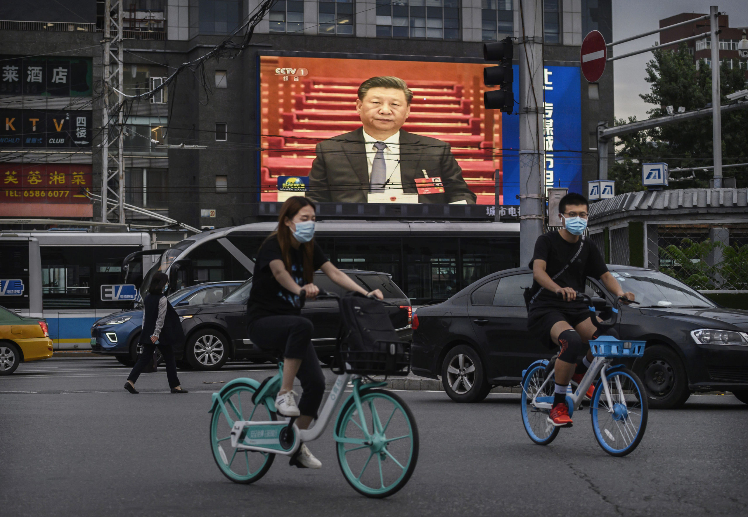 Chinese president Xi Jinping is seen on a large screen showing the evening news during a session of the National People's Congress at the Great Hall of the People on May 25, 2020 in Beijing, China. (Photo by Kevin Frayer/Getty Images)