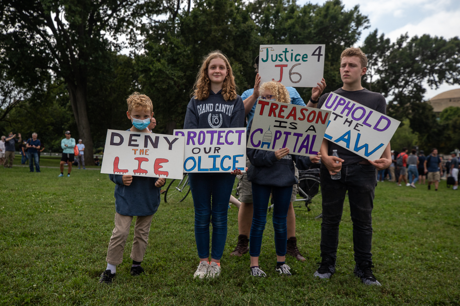 Several people carried American flags and signs in support of people jailed in connection with the Capitol riot at the “Justice for J6” rally in Washington, D.C. on September 18, 2021. (Kaylee Greenlee – Daily Caller News Foundation)