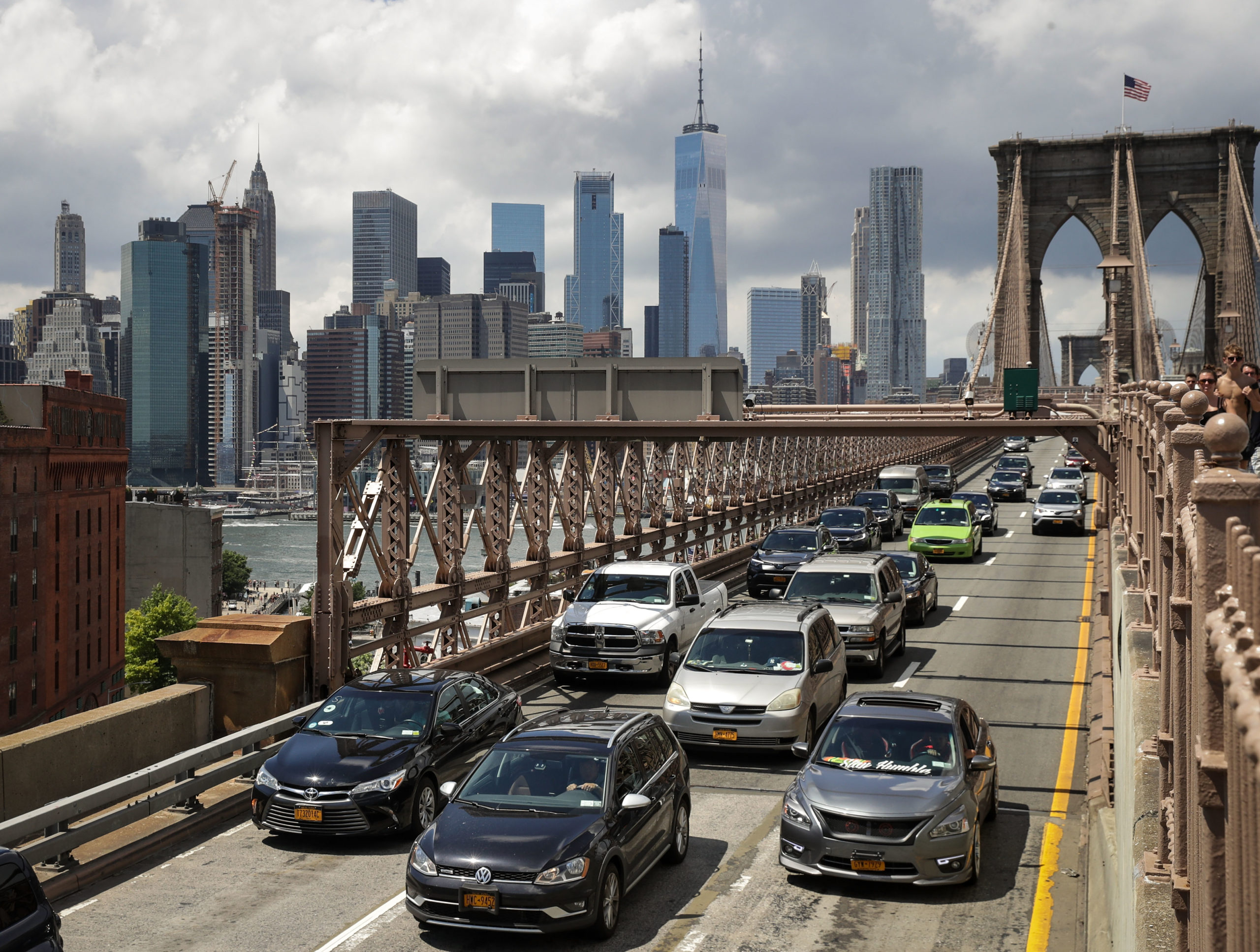 NEW YORK, NY - AUGUST 2: Traffic moves across the Brooklyn Bridge, August 2, 2018 in New York City. On Thursday, the Trump administration announced a proposal to weaken fuel-efficiency requirements for the nation's cars and trucks. The rollback is likely to spark legal challenges from California and other states. (Photo by Drew Angerer/Getty Images)