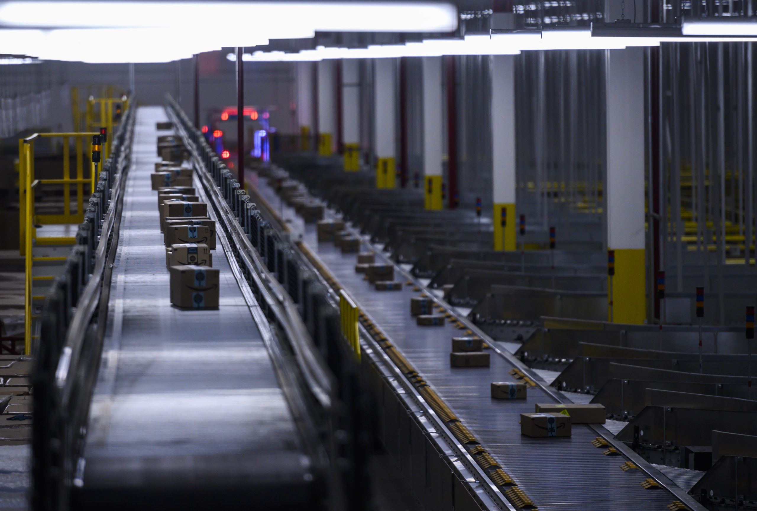 Orders move down a conveyor belt at the Amazon fulfillment center in Staten Island. (Johannes Eisele/AFP via Getty Images)